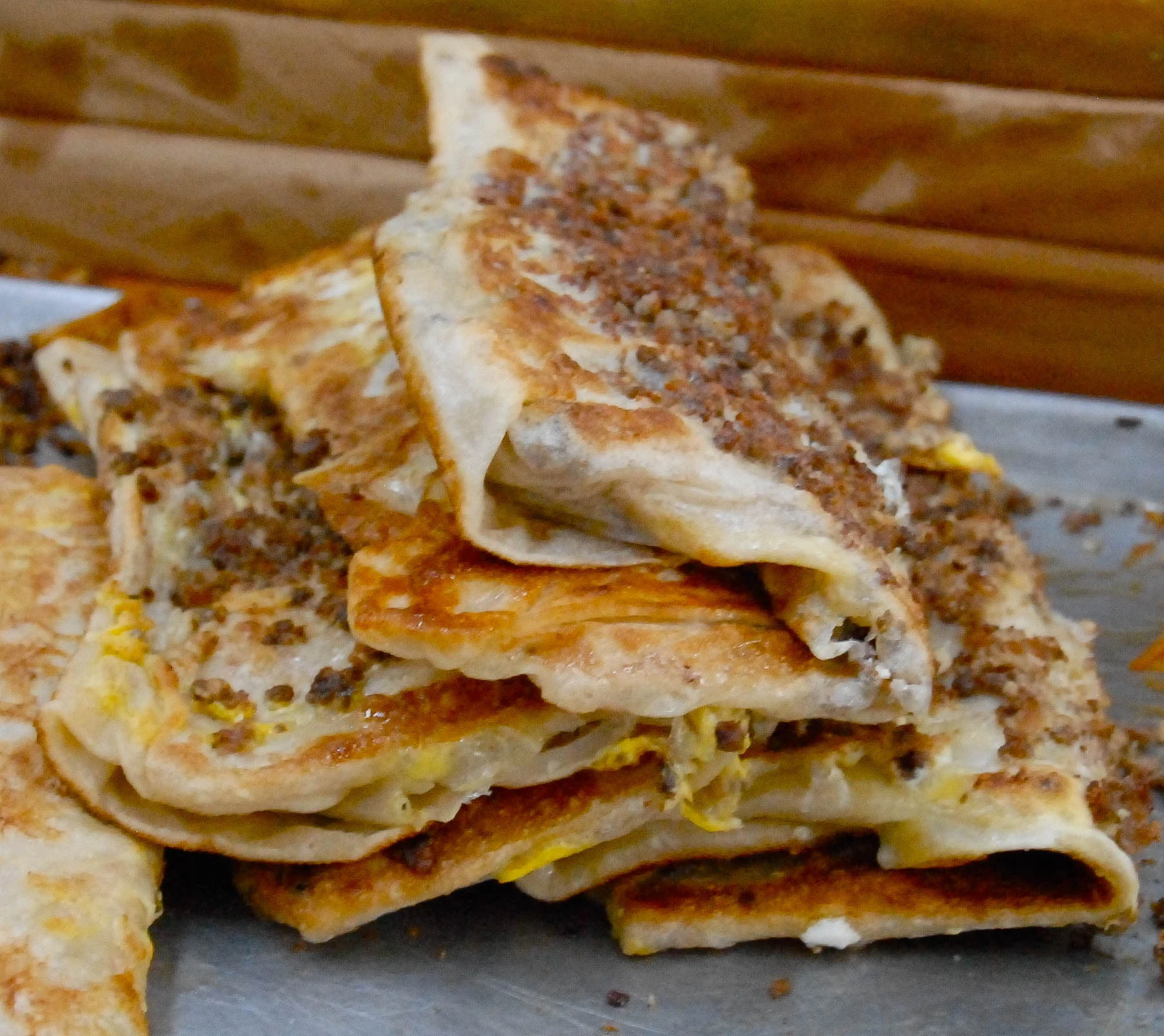 Some murtabak are so large they fold them over to fit the plate.