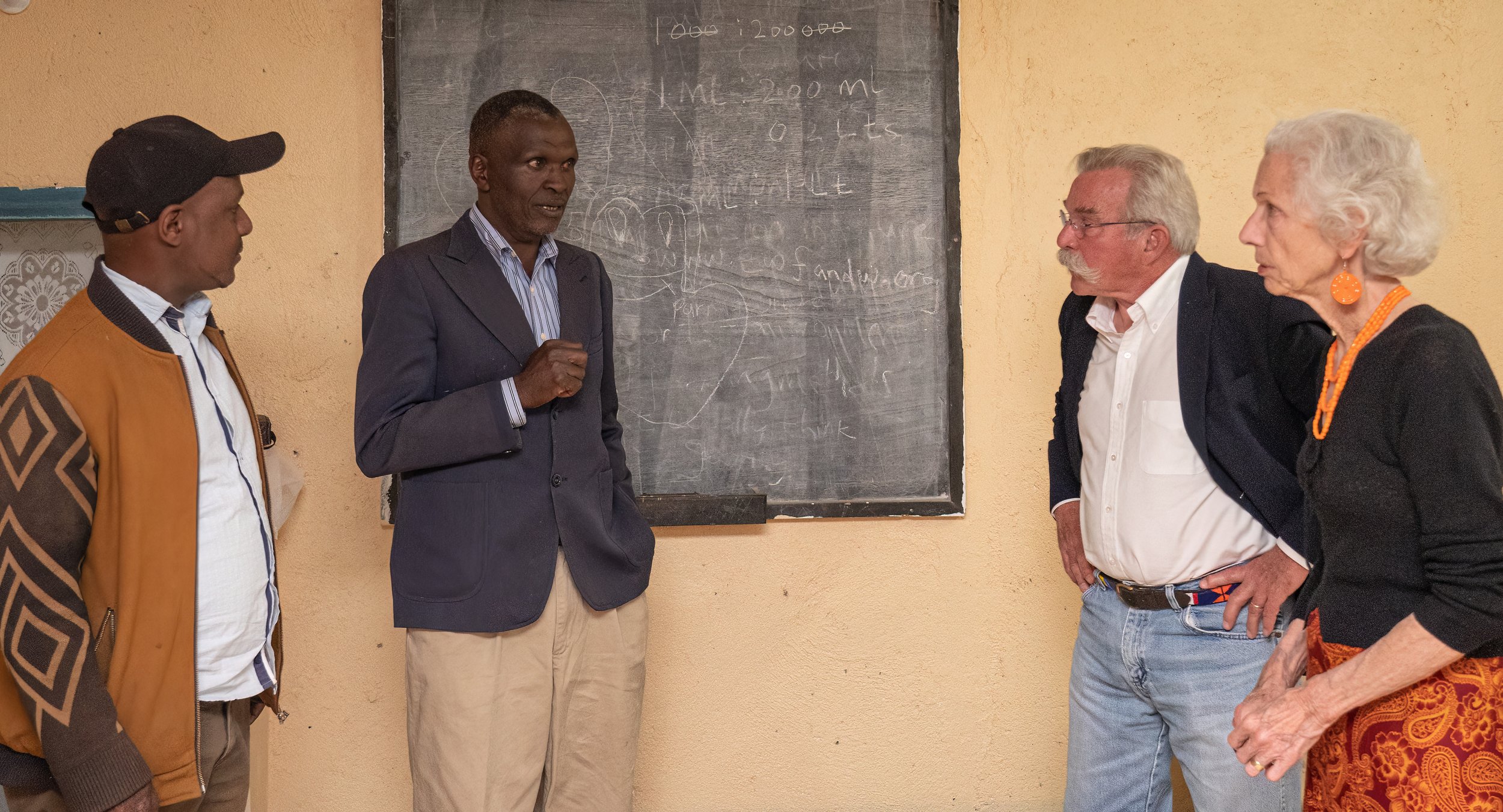 Peter Muthemba chats with Josphat, Bill, and Vivian