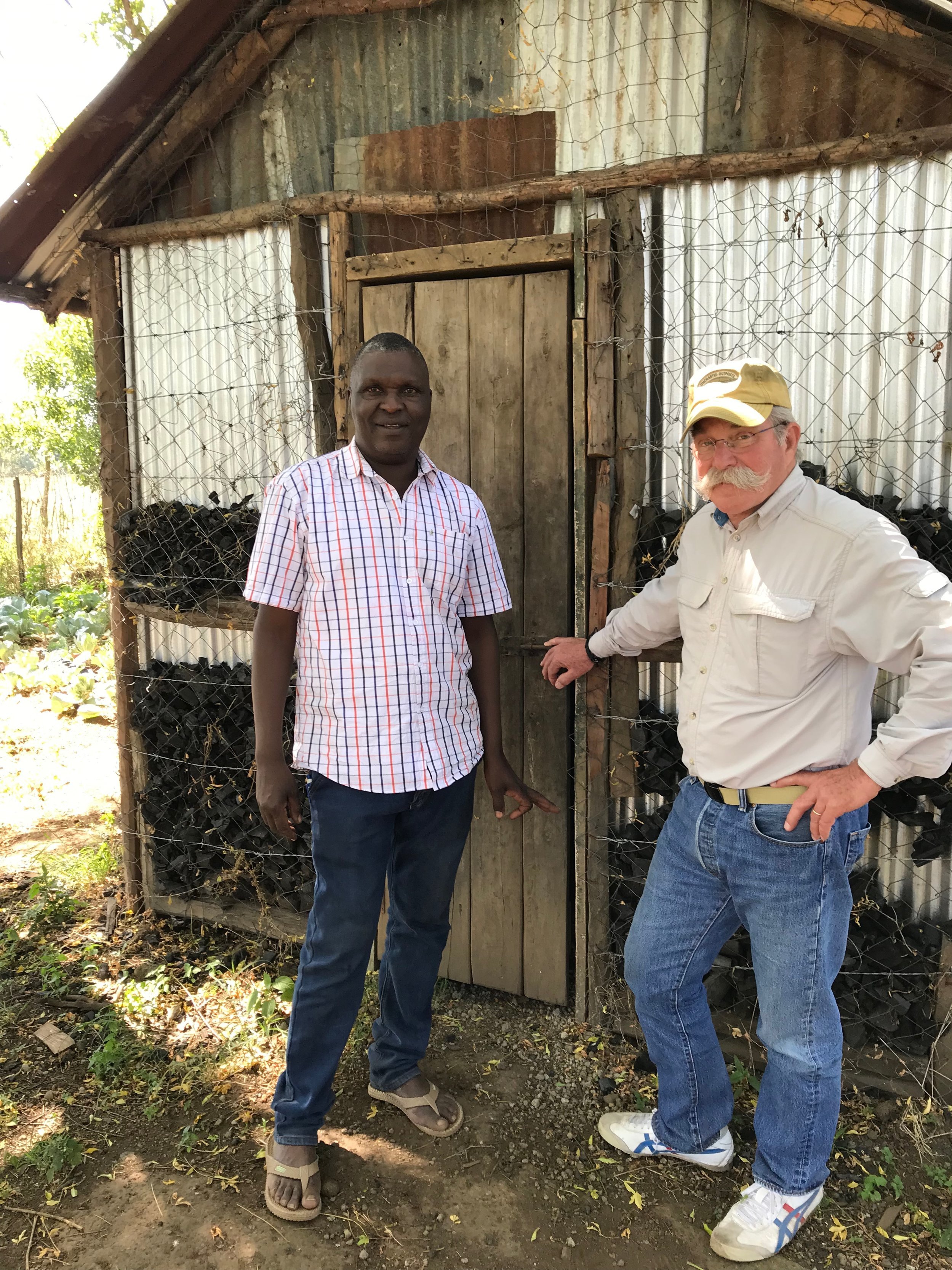 Josphat shows Bill Gast the root cellar