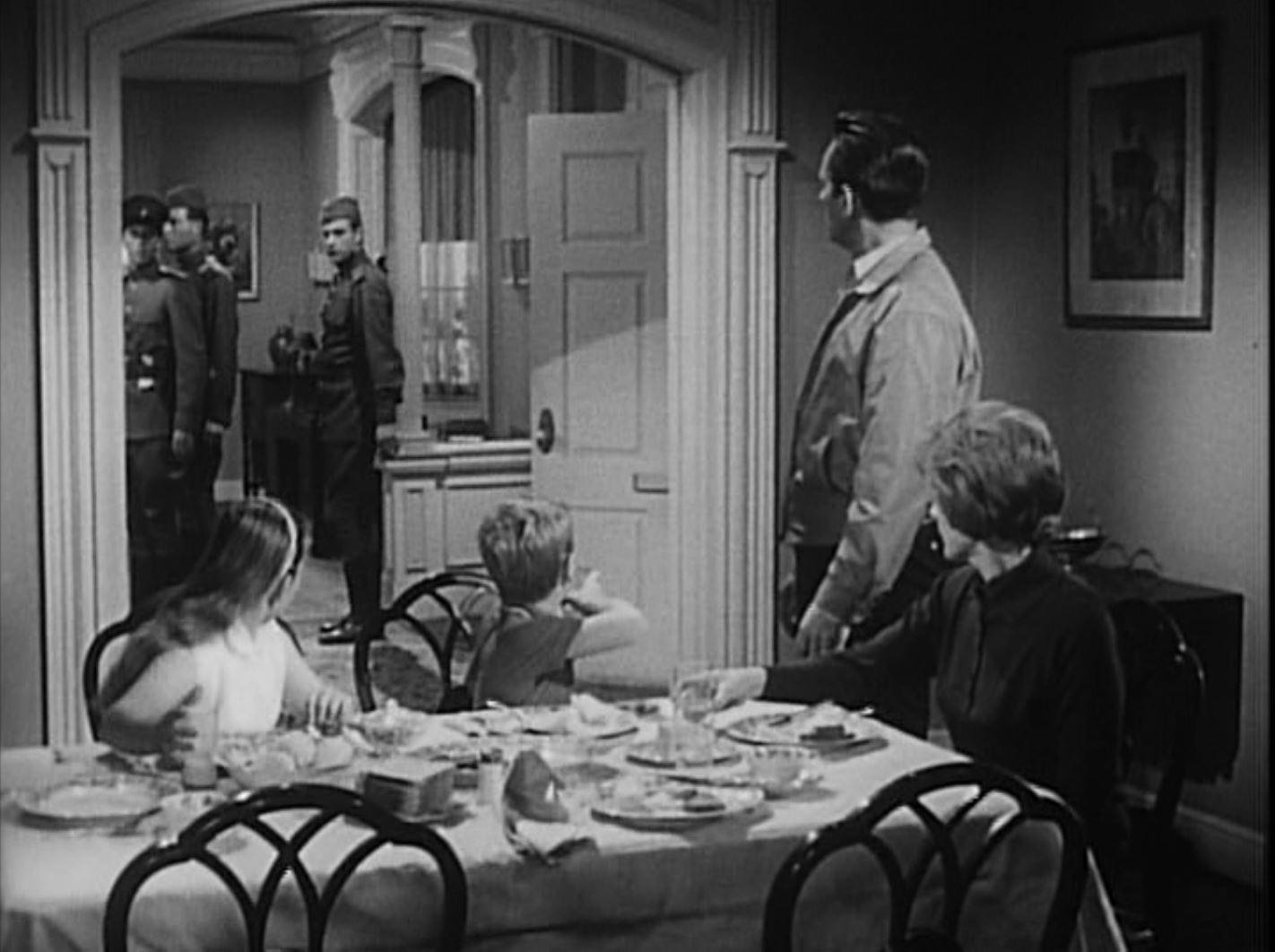 Jerry is interrupted at home by a group of soldiers entering his home