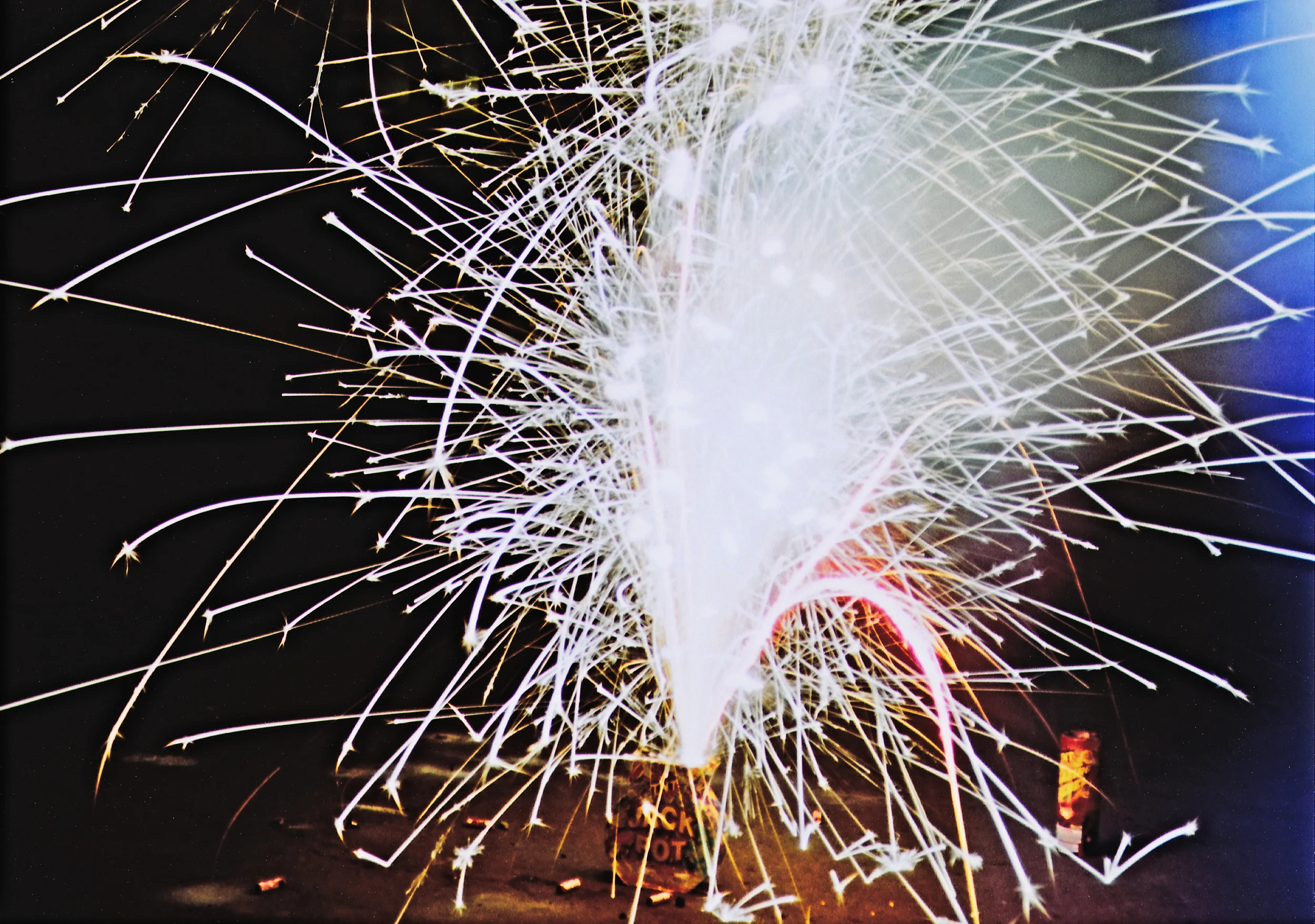Image 1: Firework shot with a Canon AE-1 w/ a light leak. The blue color shift and overexposure comes from a leaking seal. 