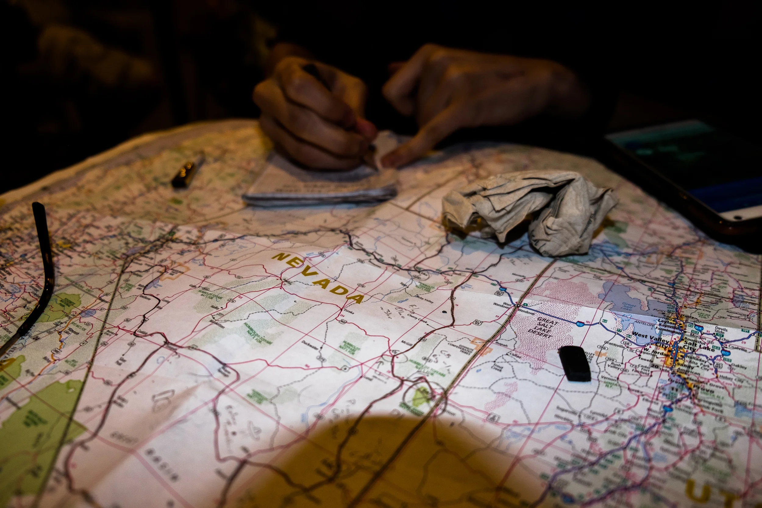 Planning the trip on a road map of the Western states.