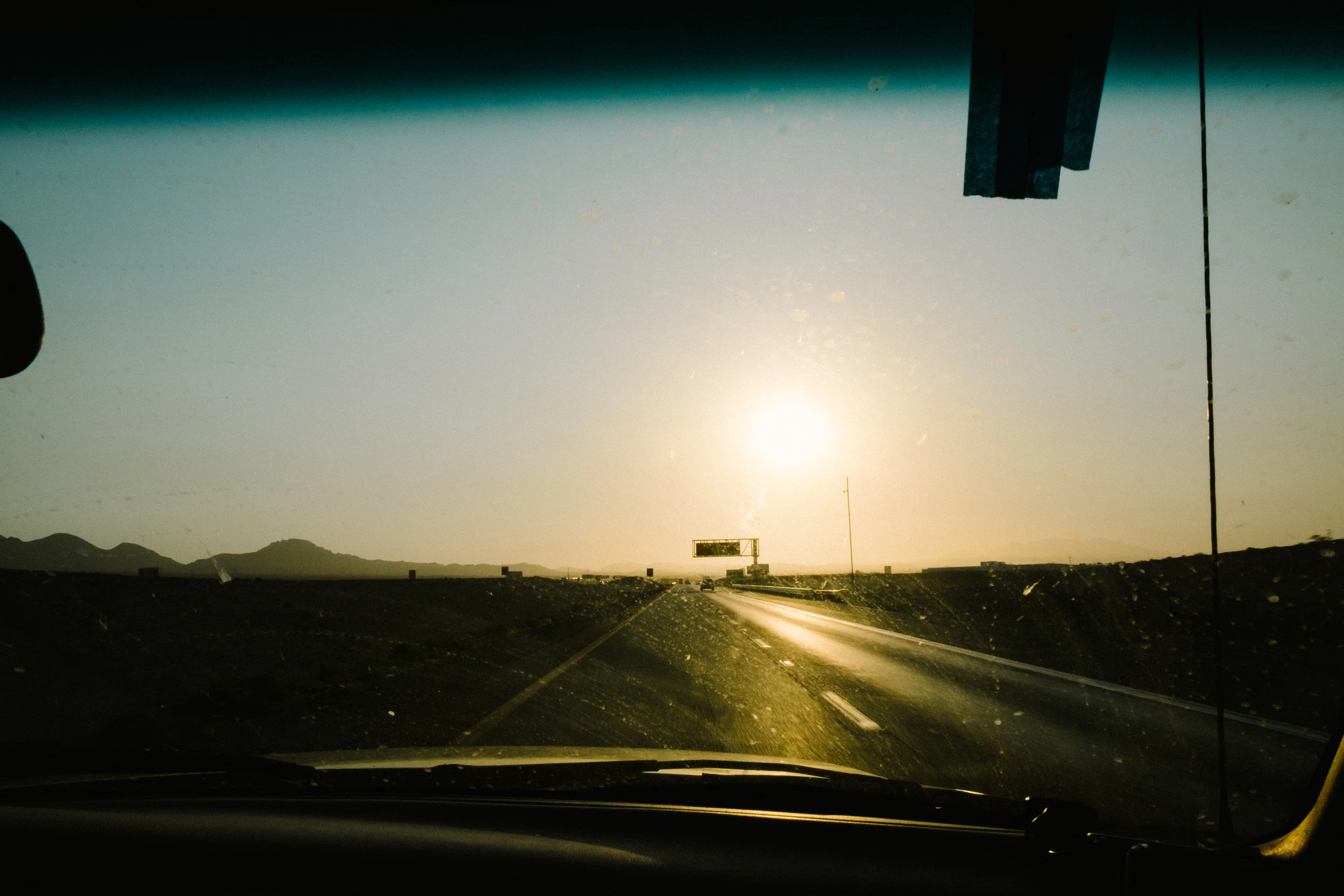 The sun breaking over I-15 heading North