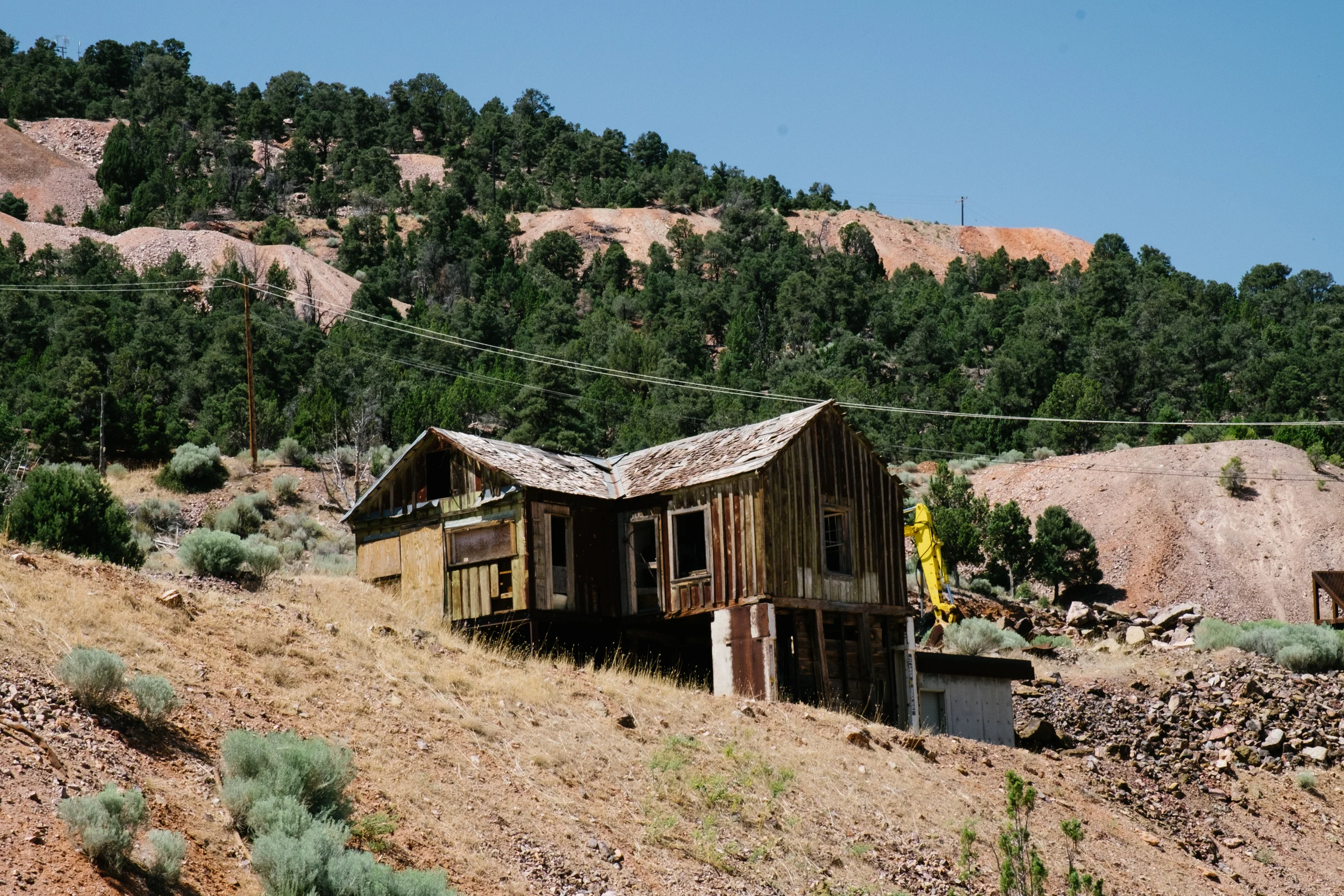 Old mining buildings like this one still stand. Though long abandoned, wooden structures like these are historic landmarks for ghost towns across Nevada.