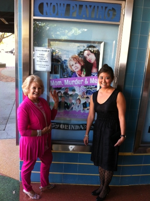 Kathy with writer-director heather Donnell at the beautiful Orinda Theatre in front of the Mom, Murder and Me poster awaiting start of film's premier showing