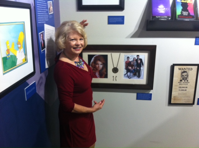 Kathy shows off her Family Affair memorabilia hung in The Paul Lisnek gallery wing of the Museum of Broadcast Communications in Chicago.