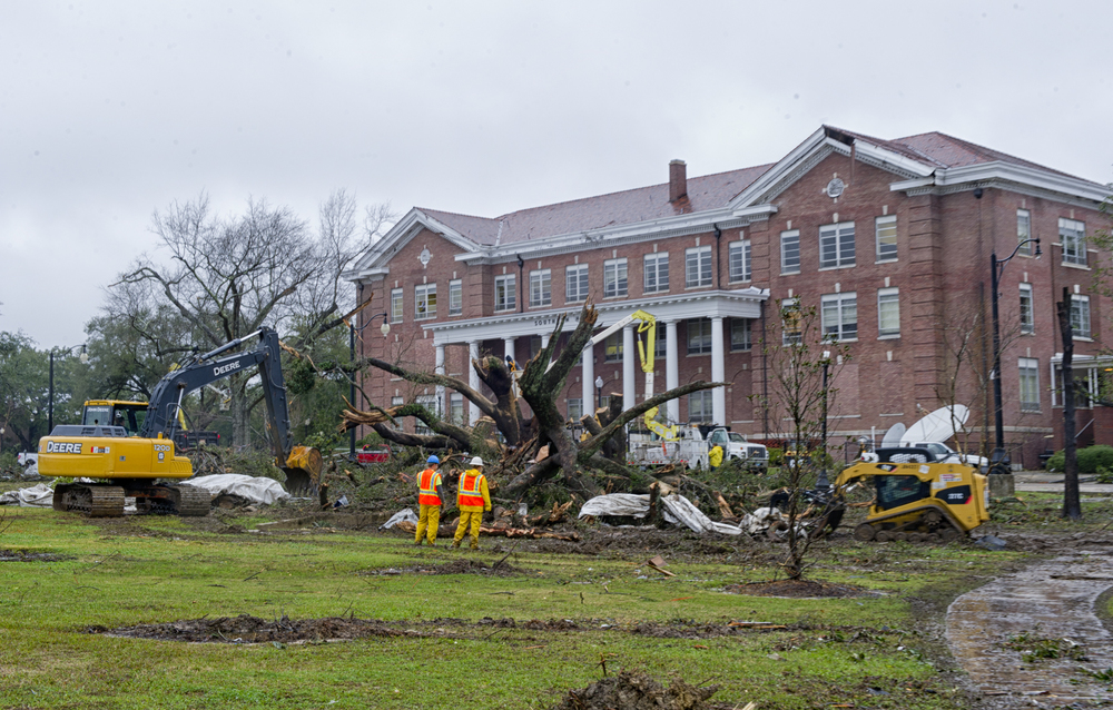 Crews work to remove tree damage to the front lawn of Southern Hall after the tornado at The University of Southern Mississippi. February 10, 2013, Hattiesburg, Miss.