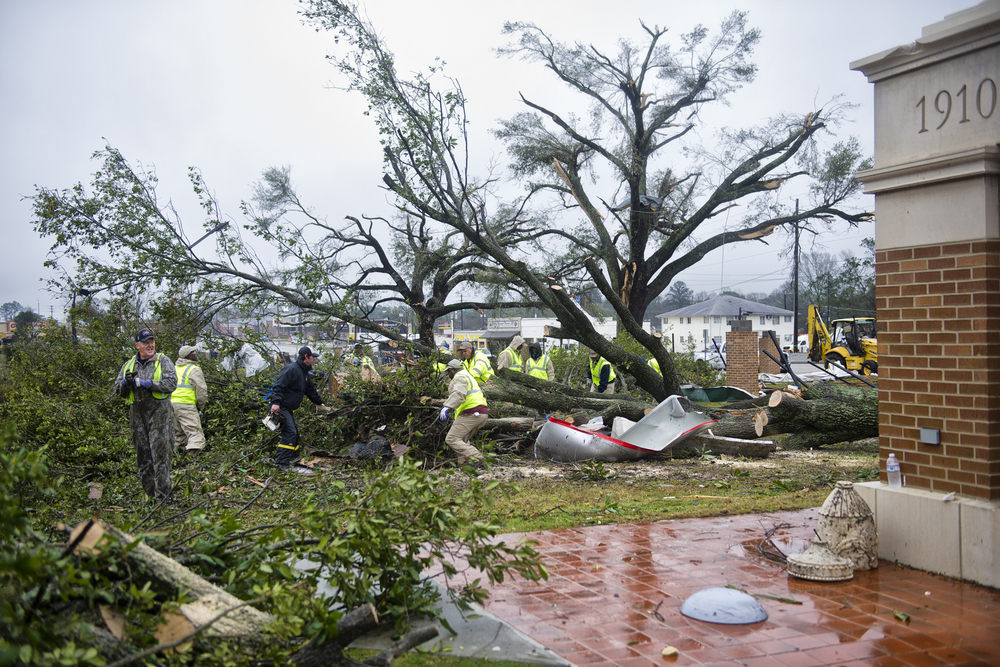 Crews work to remove tornado debris from The University of Southern Mississippi gateway. February 11, 2013, Hattiesburg, Miss.