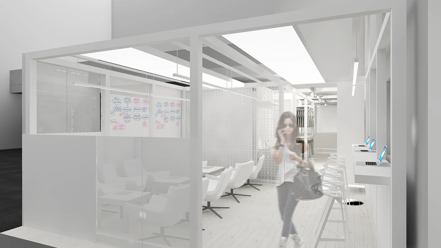 Modern office workspace with glass walls, white chairs, and a woman standing at a row of computer stations.