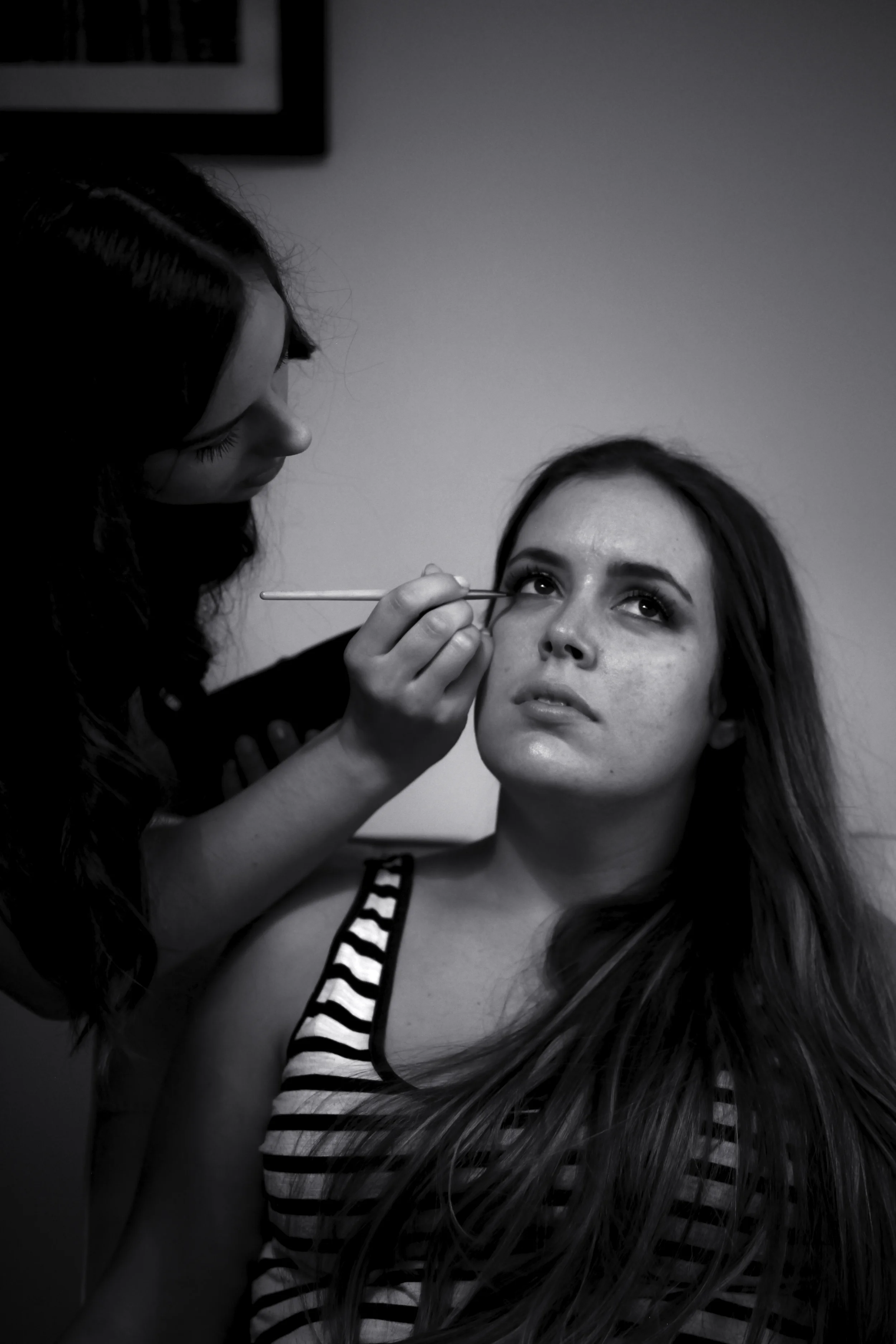 Candid moment: best friend, bridesmaid, witness and make-up artist Adna puts the finishing touches on bride Cassi.