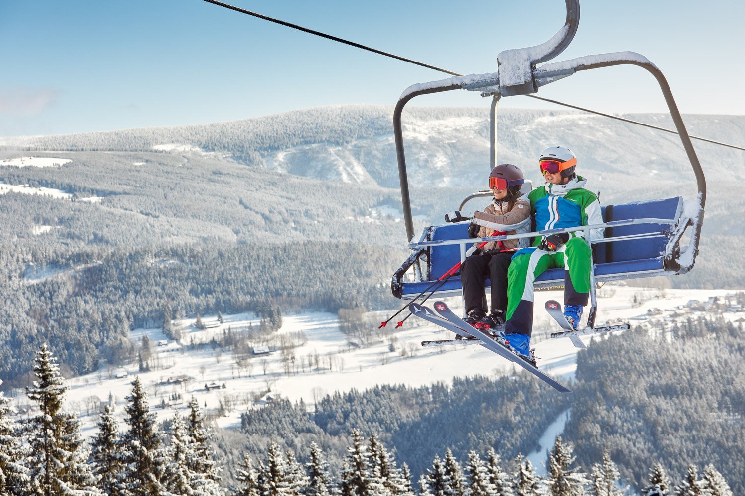 Winter travel advertising photography in SKI Herlikovice, skiing couple_Chair-lift_JiriLizler_Hospitality Photographer.jpg