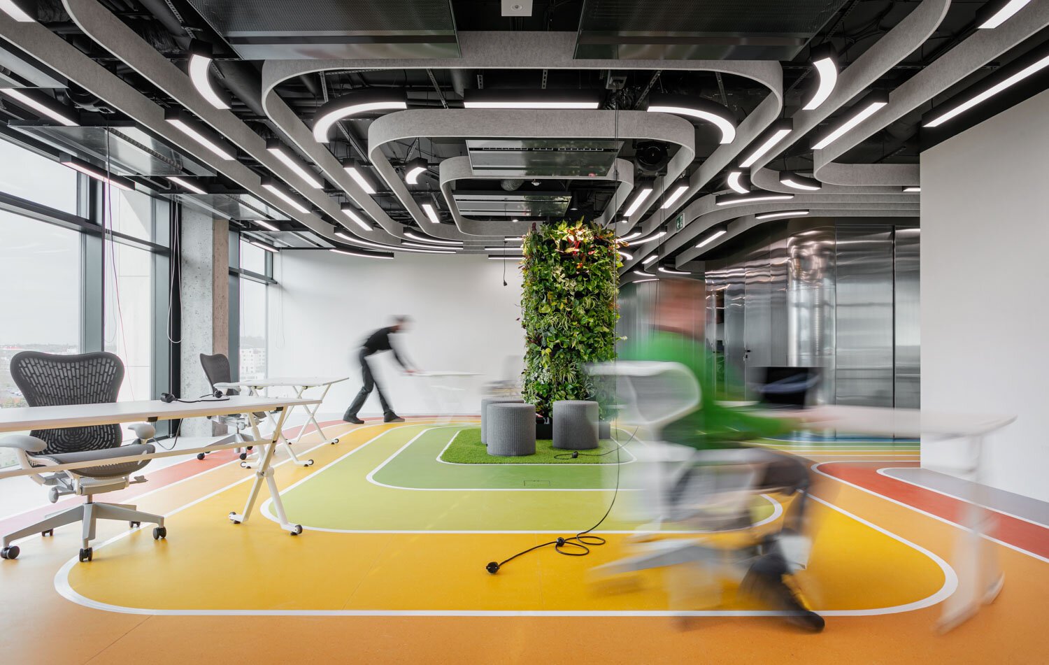 interior photo of livesport office moving tables by reaktor architects - jirilizler.com architecture photographer.JPG