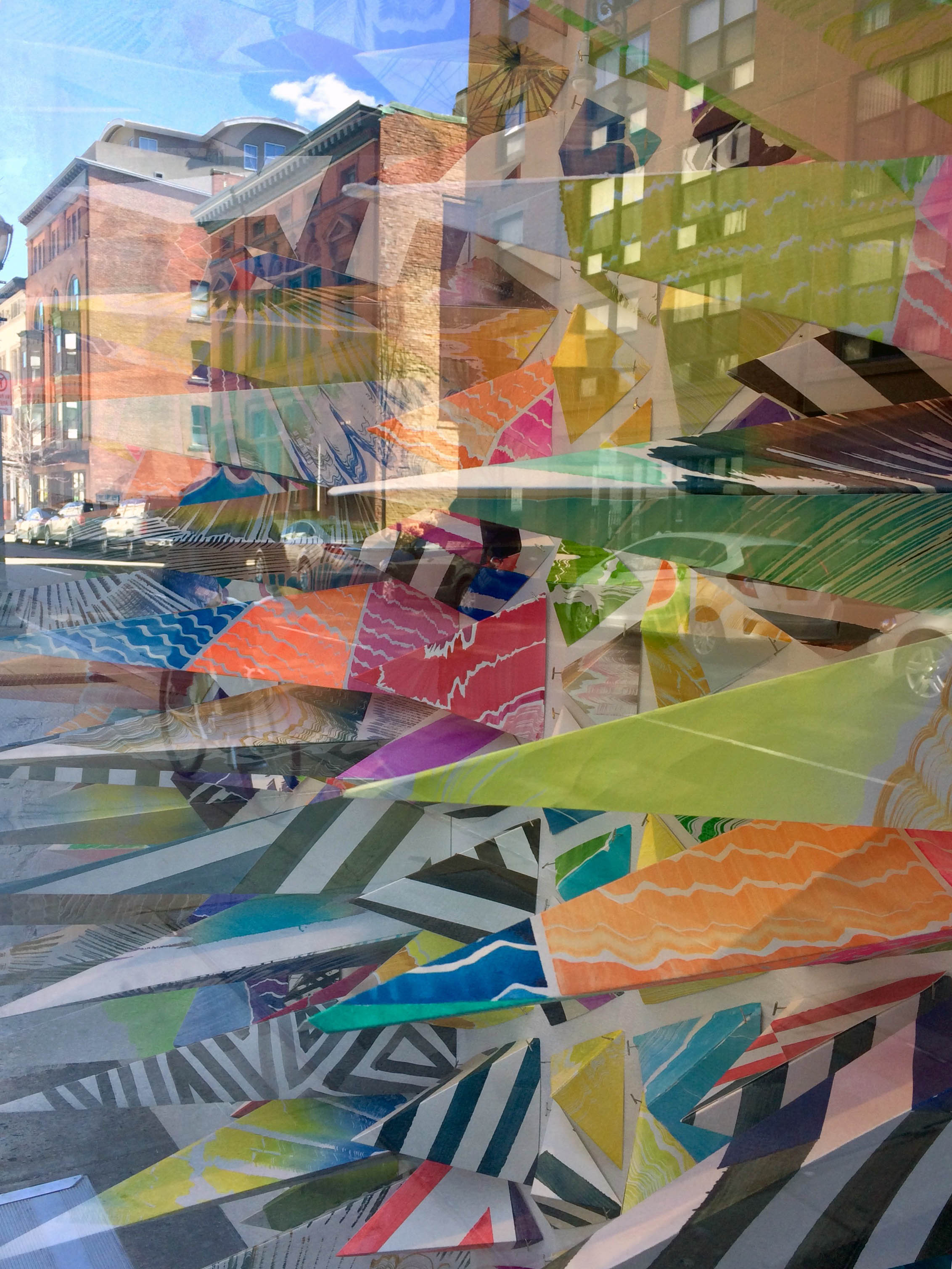 A view of the installation from outside with the reflections of the city
