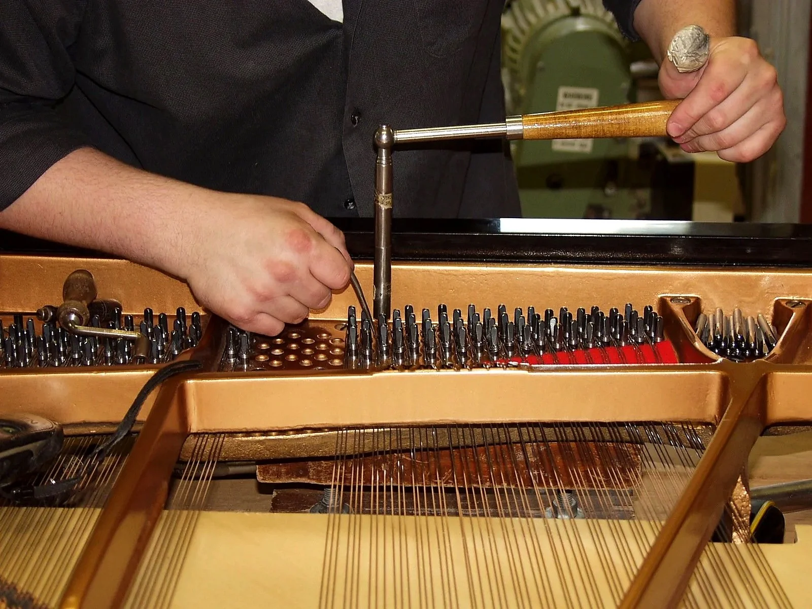 Steinway grand piano restringing during restoration by Butler & Sons Piano Restorations