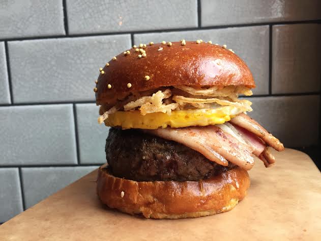 Burger of the month! Spicy Bacon & Eggs Burger- Fresh ground beef topped with a fried egg, cider braised bacon, crispy shallots & sriracha mayo. Available until February 28th