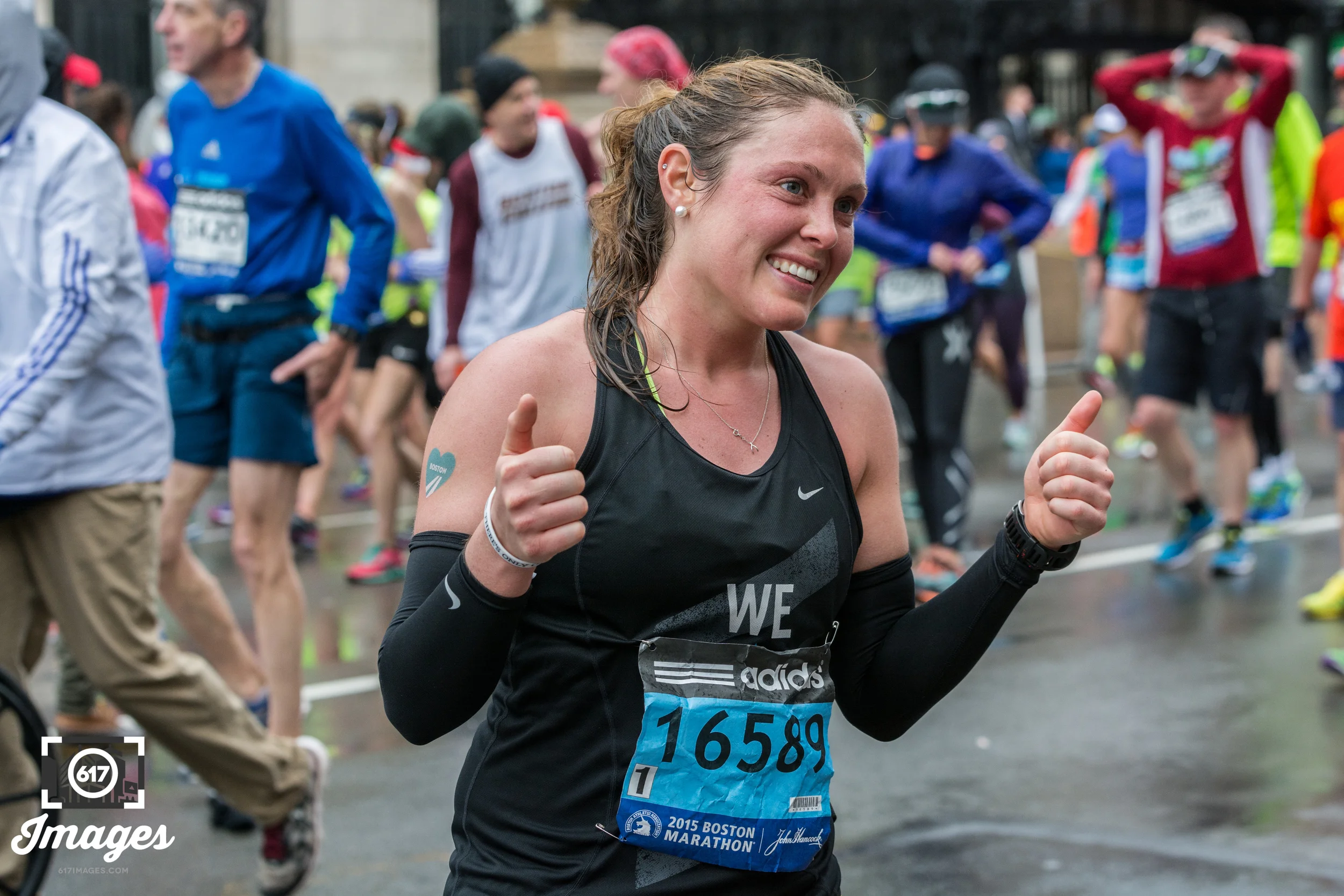 Thumbs up on finishing the marathon. 