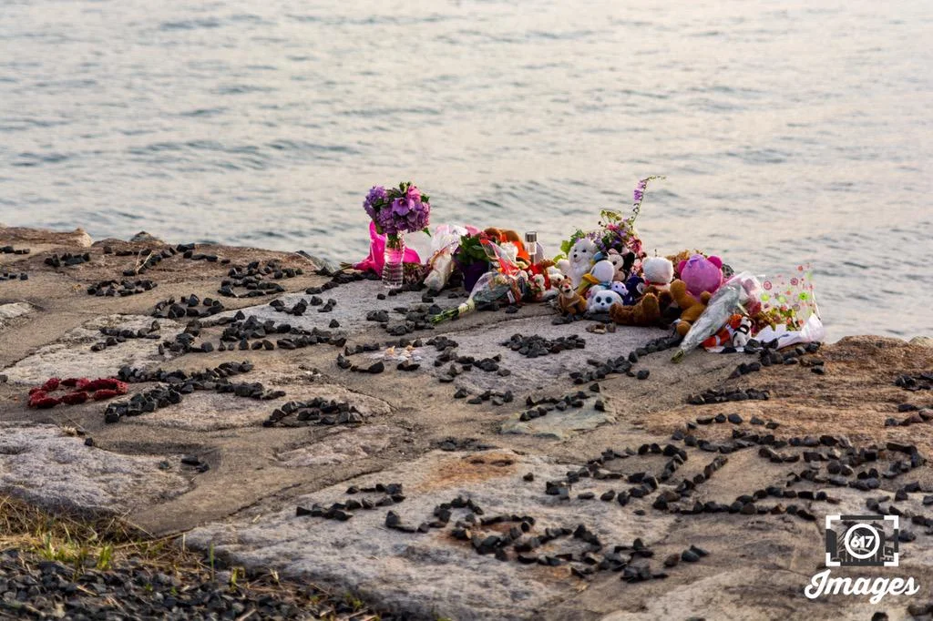Stuffed animals, toys, flowers and messages left with rocks for 'Baby Doe'