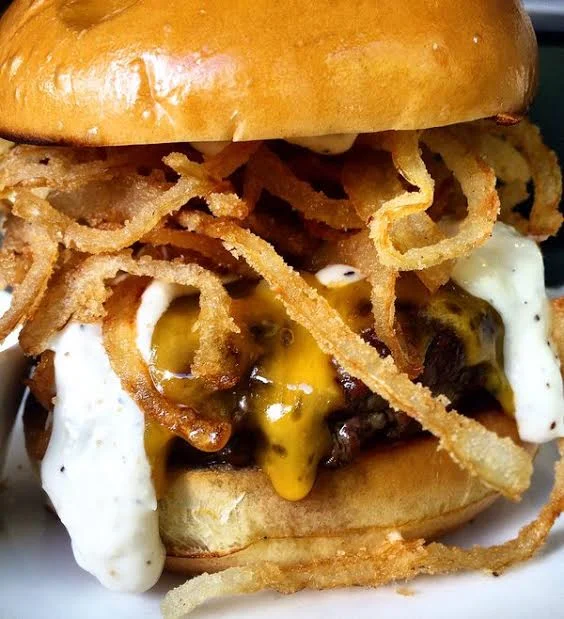 Chef Michael Schlow's famous Schlow Burger. Image via Tico