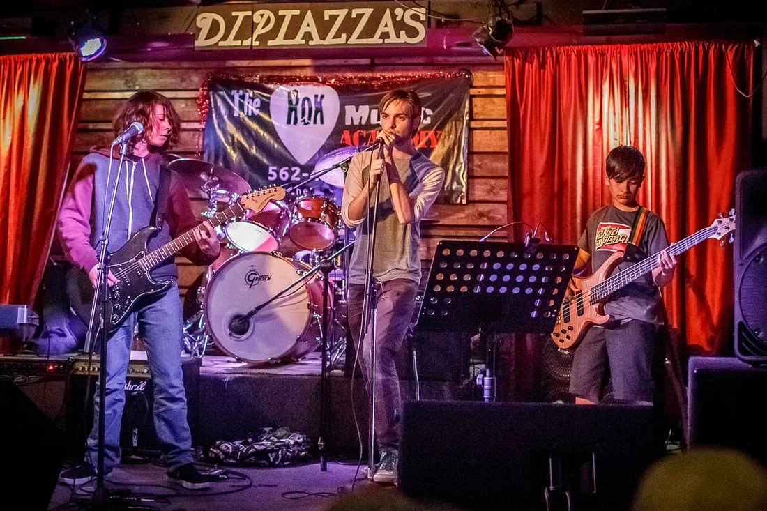 Instructor Jonathon Eastly singing for Rok students Zane , Sean and Pharaoh