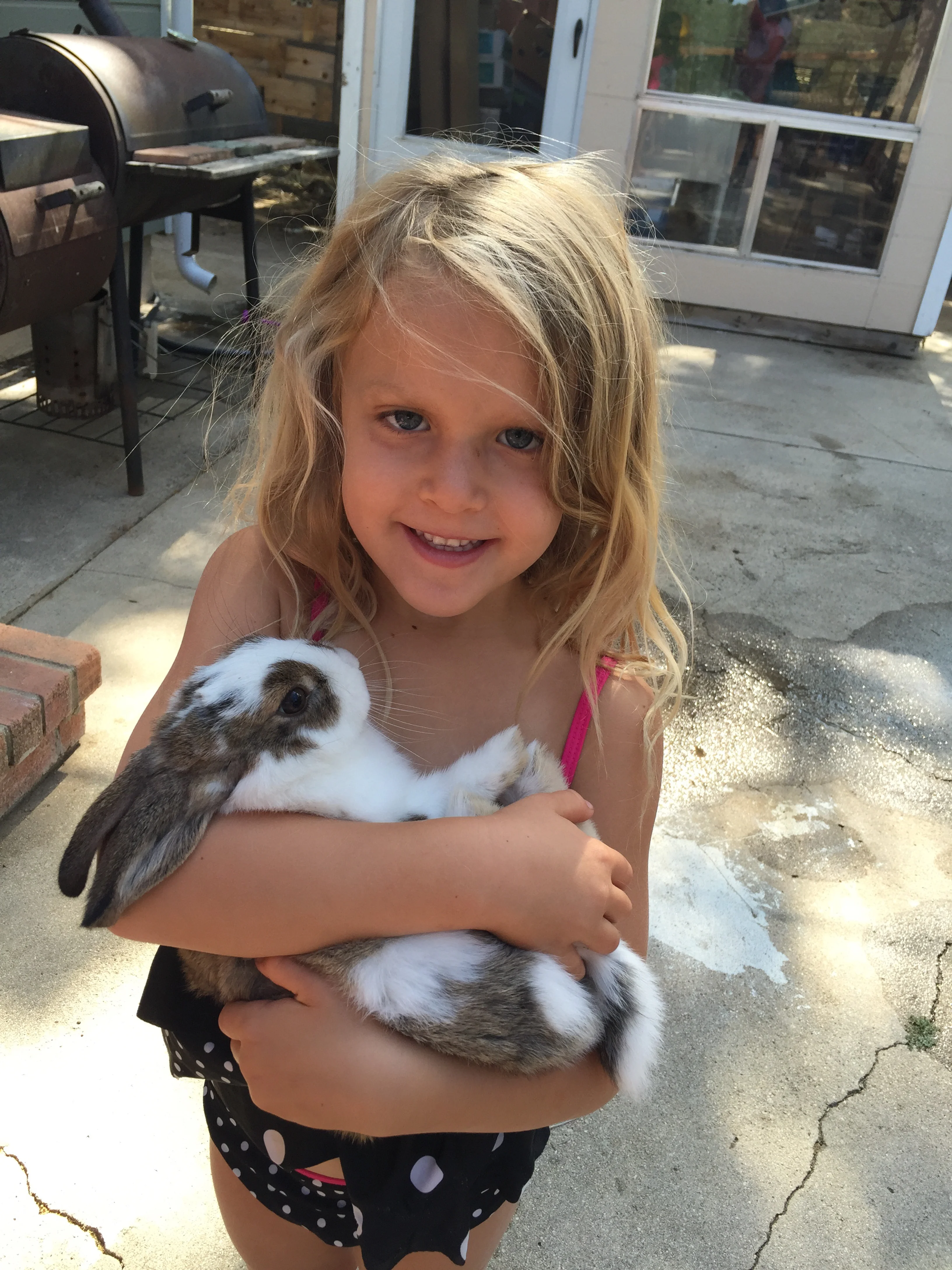 Here's Iris holding the bunny - his name is Snuggles. Moses goes around saying the bunny is his son- Lol!