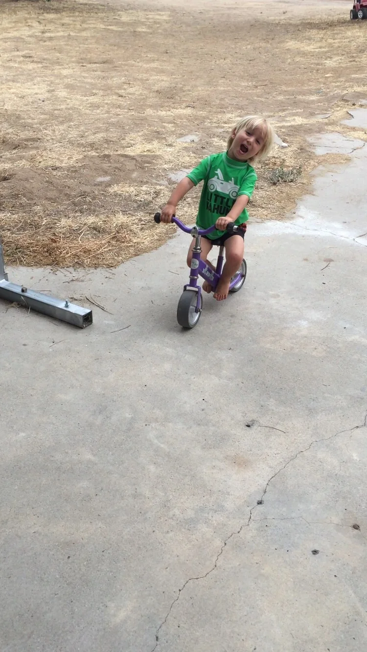 Moses on his favorite bike... He's such a goof ball!!