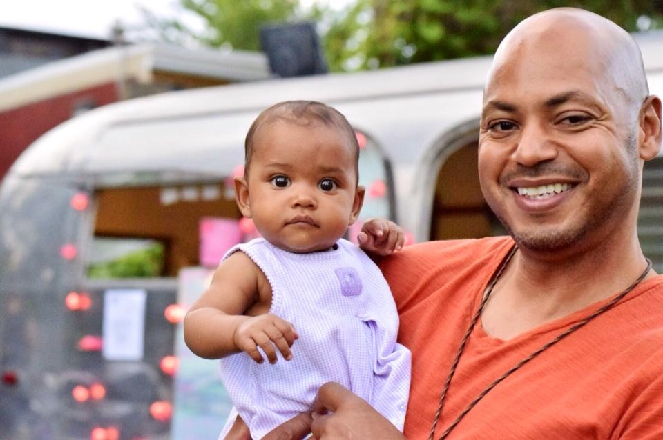 host Kiley with baby Frannie, the youngest member of Brother Nature Produce