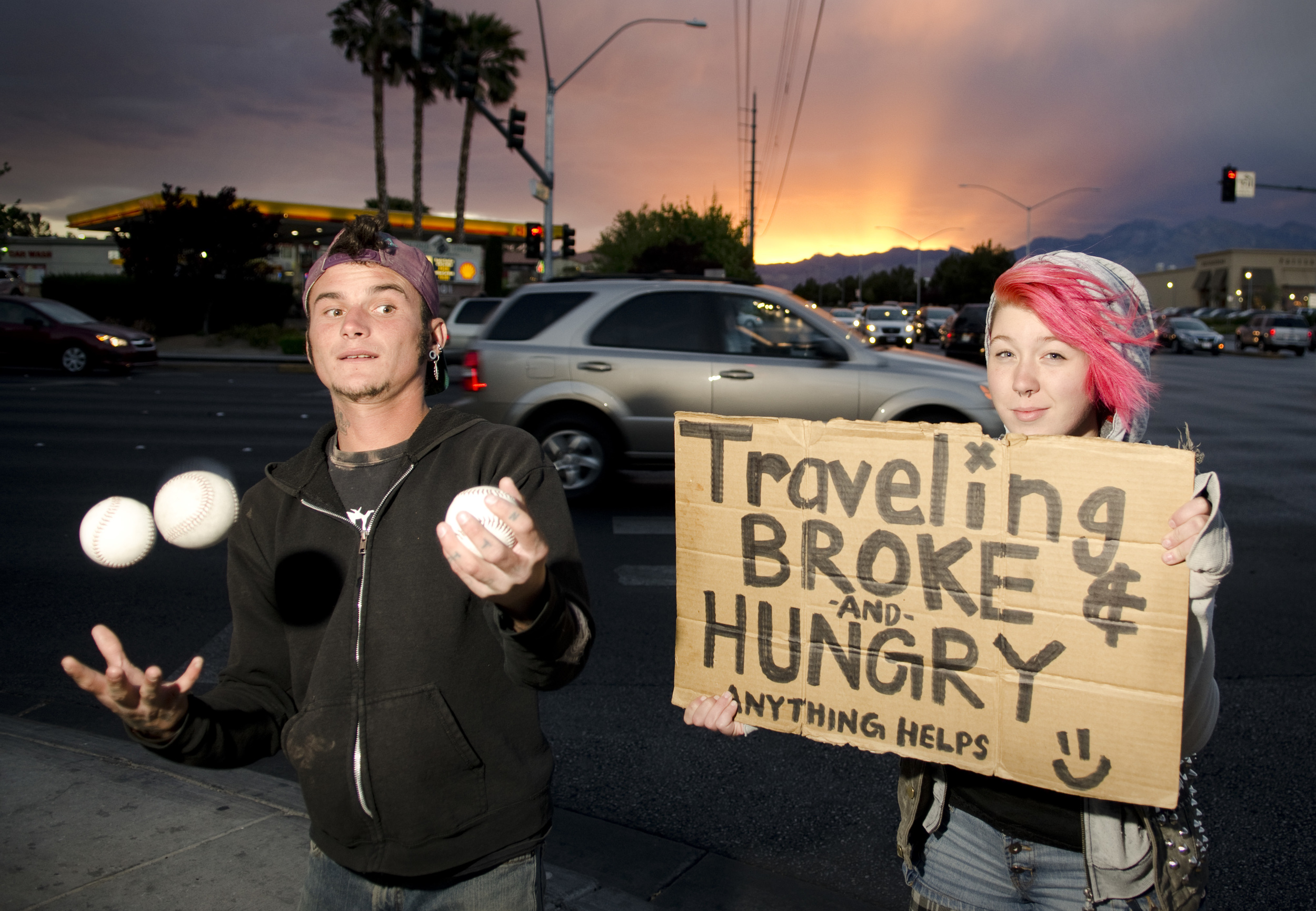 Panhandlers pose for a semi-candid portrait at Charleston and Rampart in Las Vegas, Nevada. 