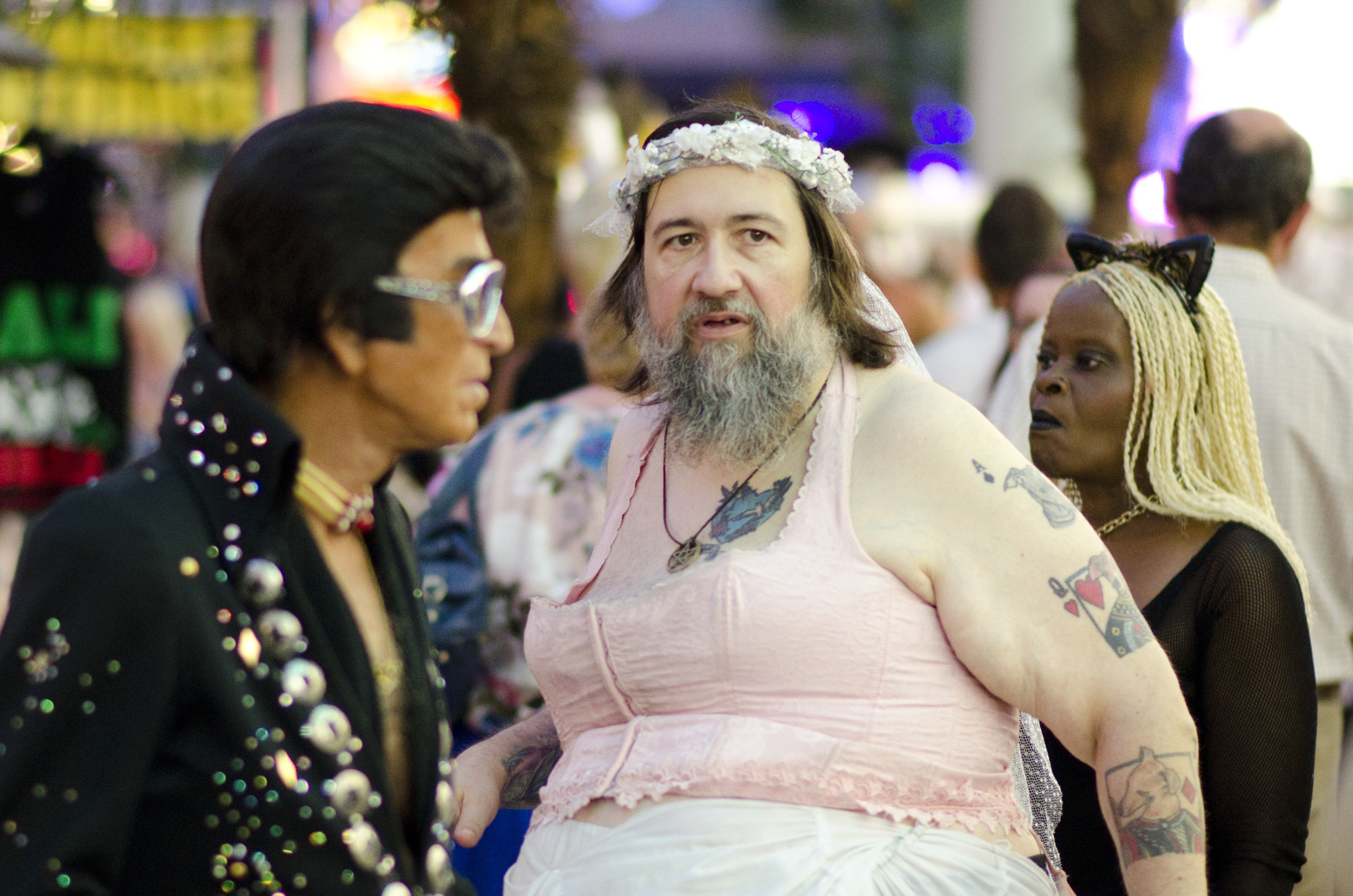 Buskers in Las Vegas' Fremont Street Experience wait to solicit tips for having their photo taken.