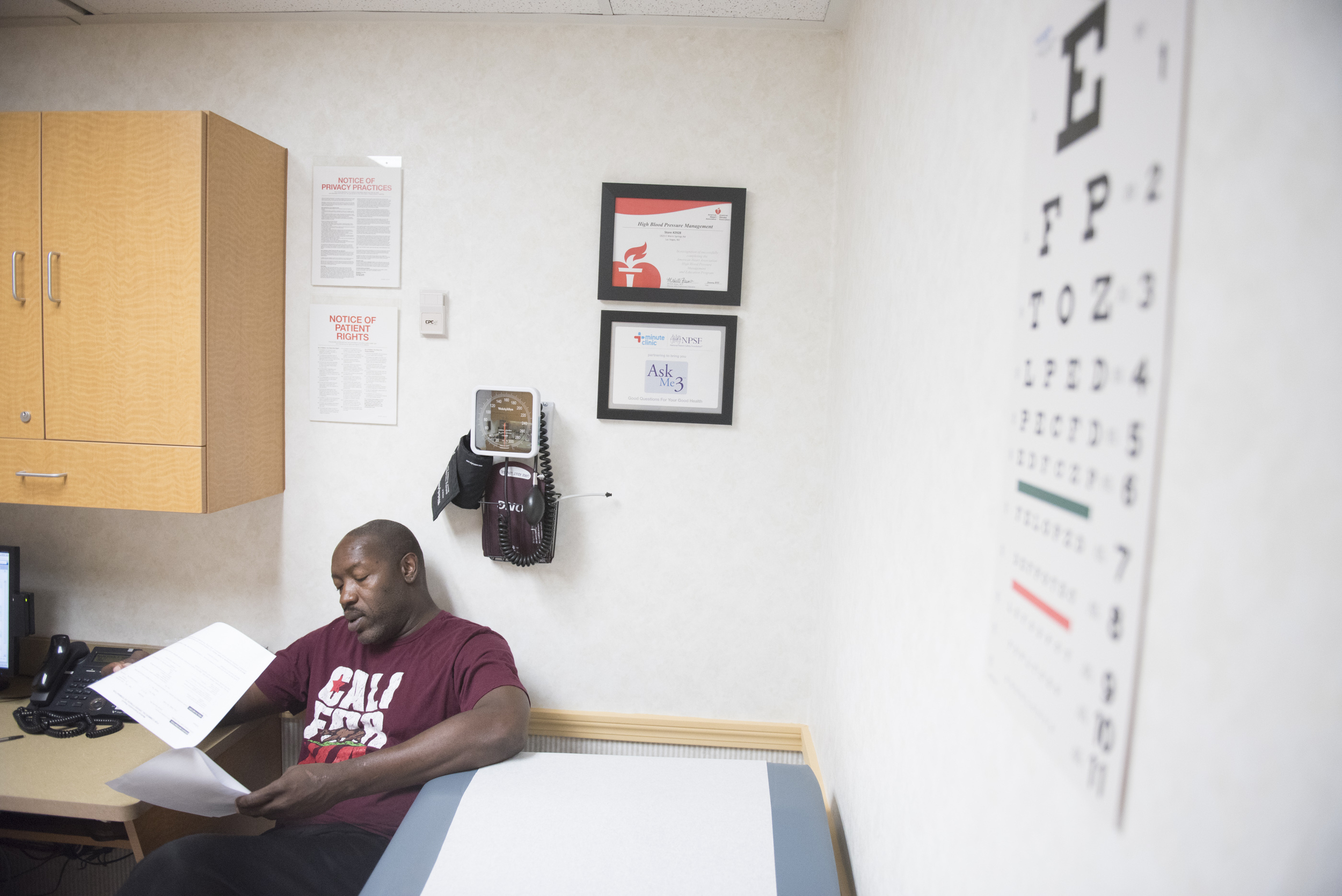 Anthony Howard reviews paperwork at CVS Pharmacy's Minute Clinic at 1825 East Warm Springs Road in Las Vegas, Thursday, Aug. 13, 2015. Howard visits the clinic to have a physical for a driving position with the Department of Transportation. (Jason Ogulnik/Las Vegas Review-Journal)