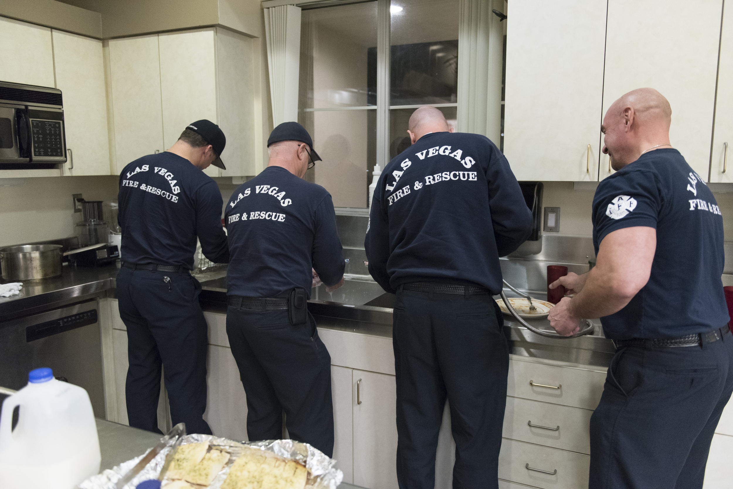 The crew washes dishes used during dinner at Las Vegas Fire & Rescue's Fire Station 41 in Las Vegas Monday, Jan. 11, 2016. Jason Ogulnik/Las Vegas Review-Journal