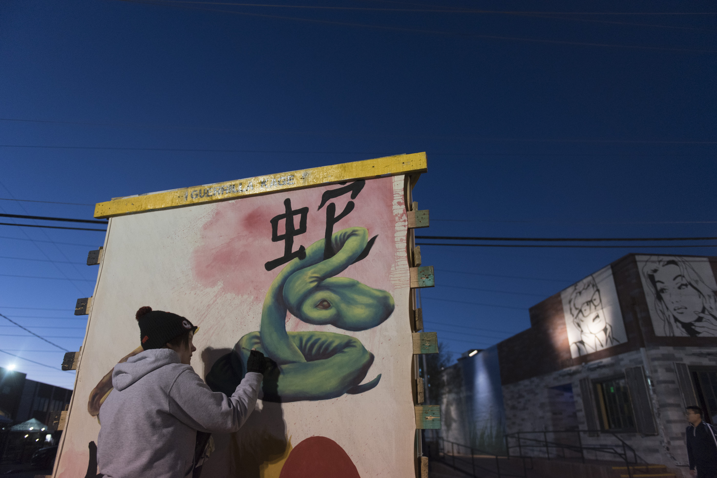 Las Vegas Academy senior Paige Johnson works on her Chinese New Year themed Guerrilla Kage art panel during the First Friday arts festival in downtown Las Vegas' 18b Arts District Friday, Feb. 5, 2016. The festival resumed after several months off to reorganize. Jason Ogulnik/Las Vegas Review-Journal
