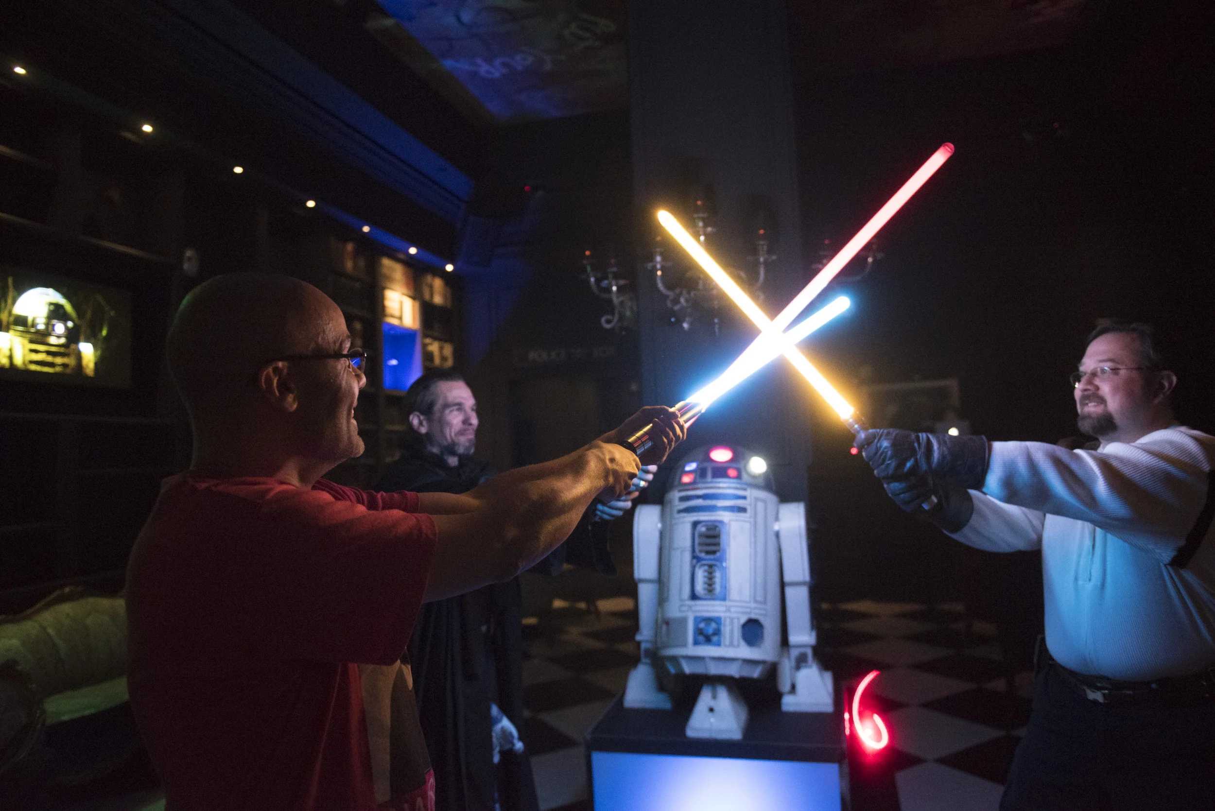 Alex Pusineri, owner of Millennium Fandom Bar, left, Steven See, center, and Gabriel Colbaugh demonstrate their lightsabers during a Star Wars themed night at the bar at 900 Las Vegas Blvd. South in Las Vegas Saturday, Feb. 27, 2016. Jason Ogulnik/Las Vegas Review-Journal