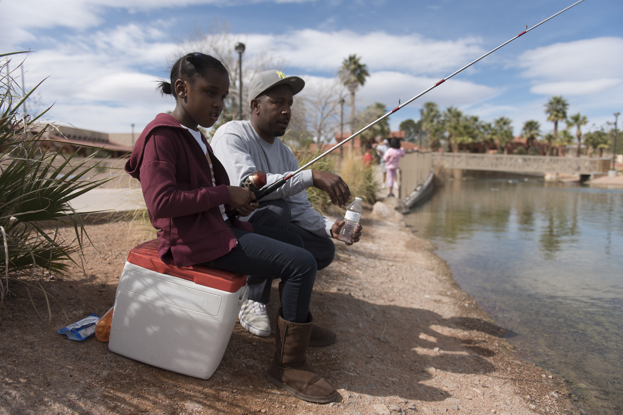 Seven-year-old Kenedie Crane, left, and her father Derrick Crane participate in the Councilman Ricki Y. Barlow Fishing Derby at Lorenzi Park at 3343 W. Washington Ave. in Las Vegas Saturday, March 5, 2016. Jason Ogulnik/Las Vegas Review-Journal