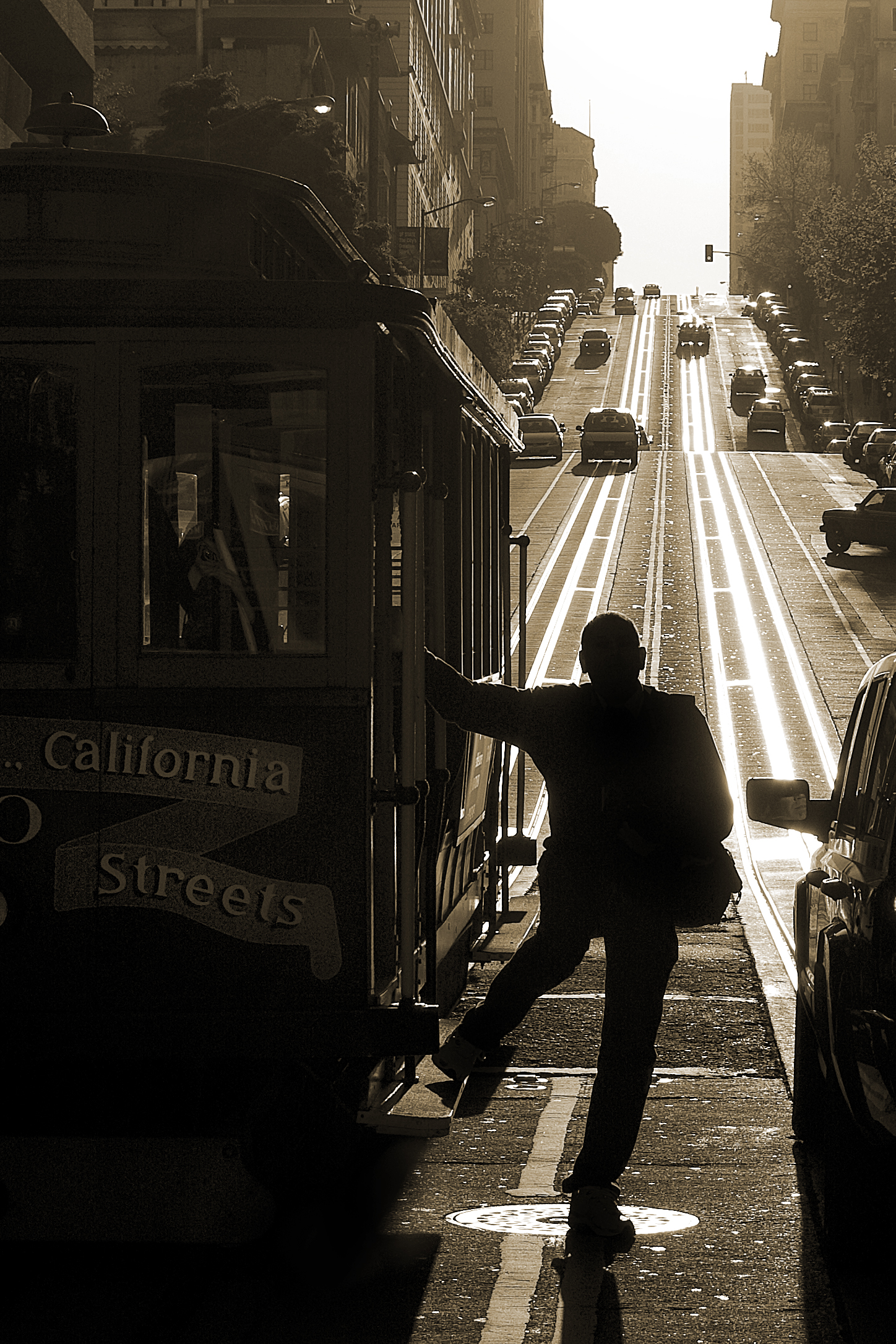 A man exits a cable car on the California Street - Van Ness Avenue line in San Francisco, Calif. Sunday, Mar. 29, 2009.
