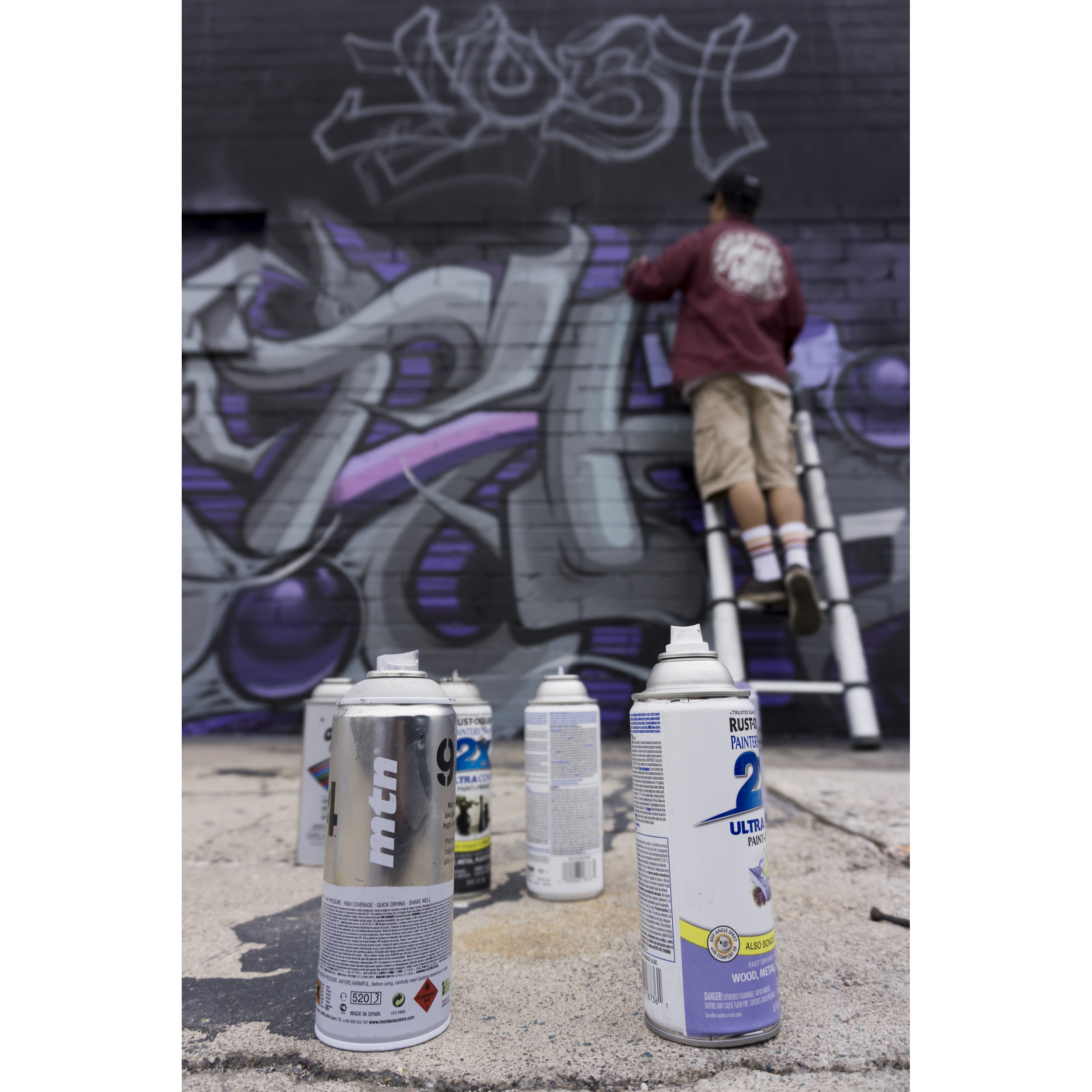 Artist Ivan Preciado of San Bernardino, Calif. paints a Prince-themed mural on Colorado Avenue at Main Street in Las Vegas Monday, April 25, 2016. Eclectic musician, Prince passed away on Thursday last week.