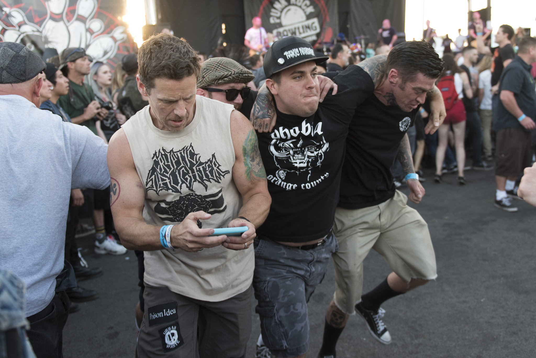 A Festivalgoer runs around the circle pit while holding their phone as The Bronx performs during the 18th annual Punk Rock Bowling & Music Festival in downtown Las Vegas Saturday, May 28, 2016.