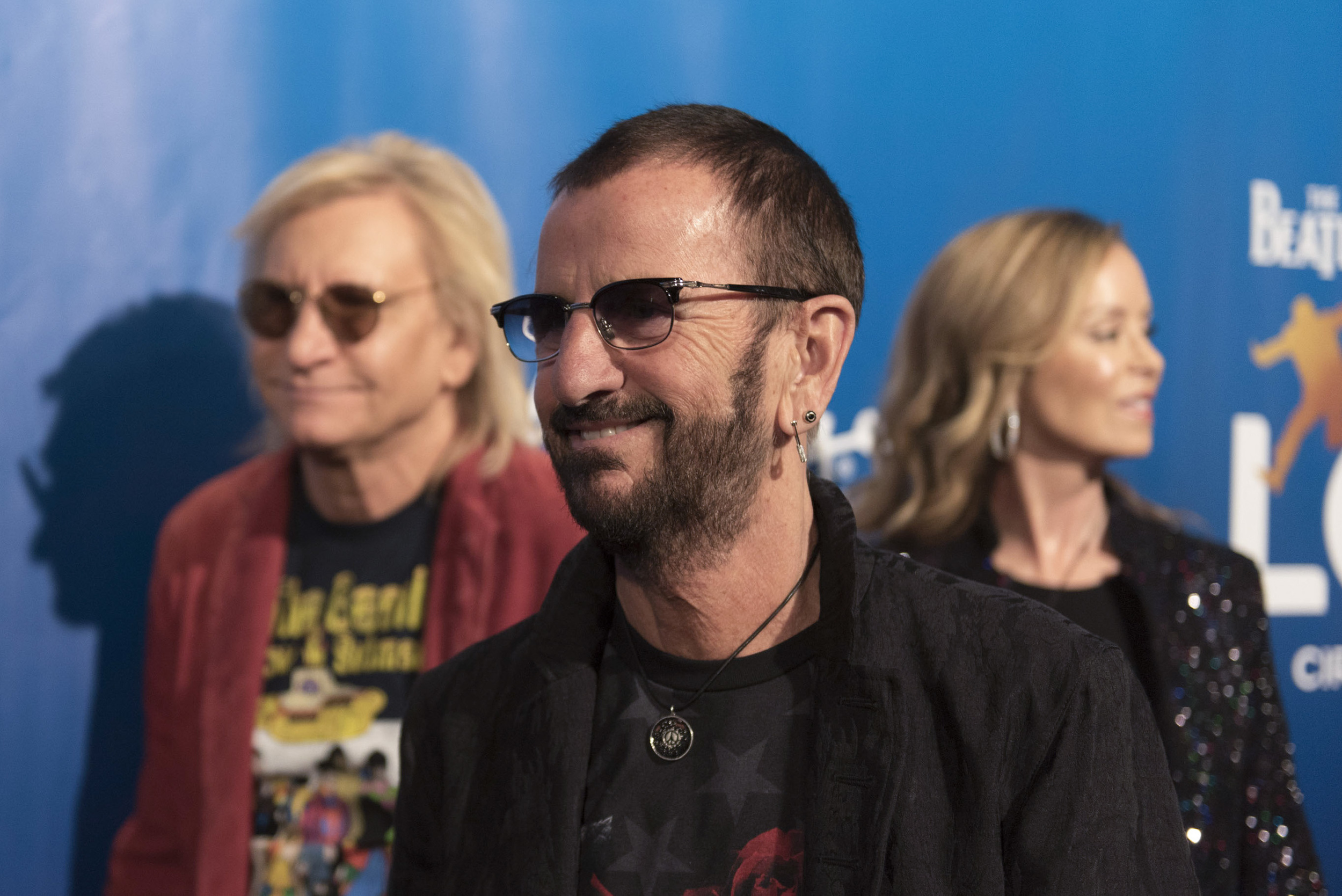 Drummer for the Beatles Ringo Starr, center, poses during a red carpet event to celebrate the 10th anniversary of Cirque du Soleil's The Beatles LOVE at The Mirage hotel-casino in Las Vegas Thursday, July 14, 2016. Joe Walsh of Ringo Starr & His All-Starr Band, left, and Walsh's wife, Marjorie Bach, look on. Jason Ogulnik/Las Vegas Review-Journal
