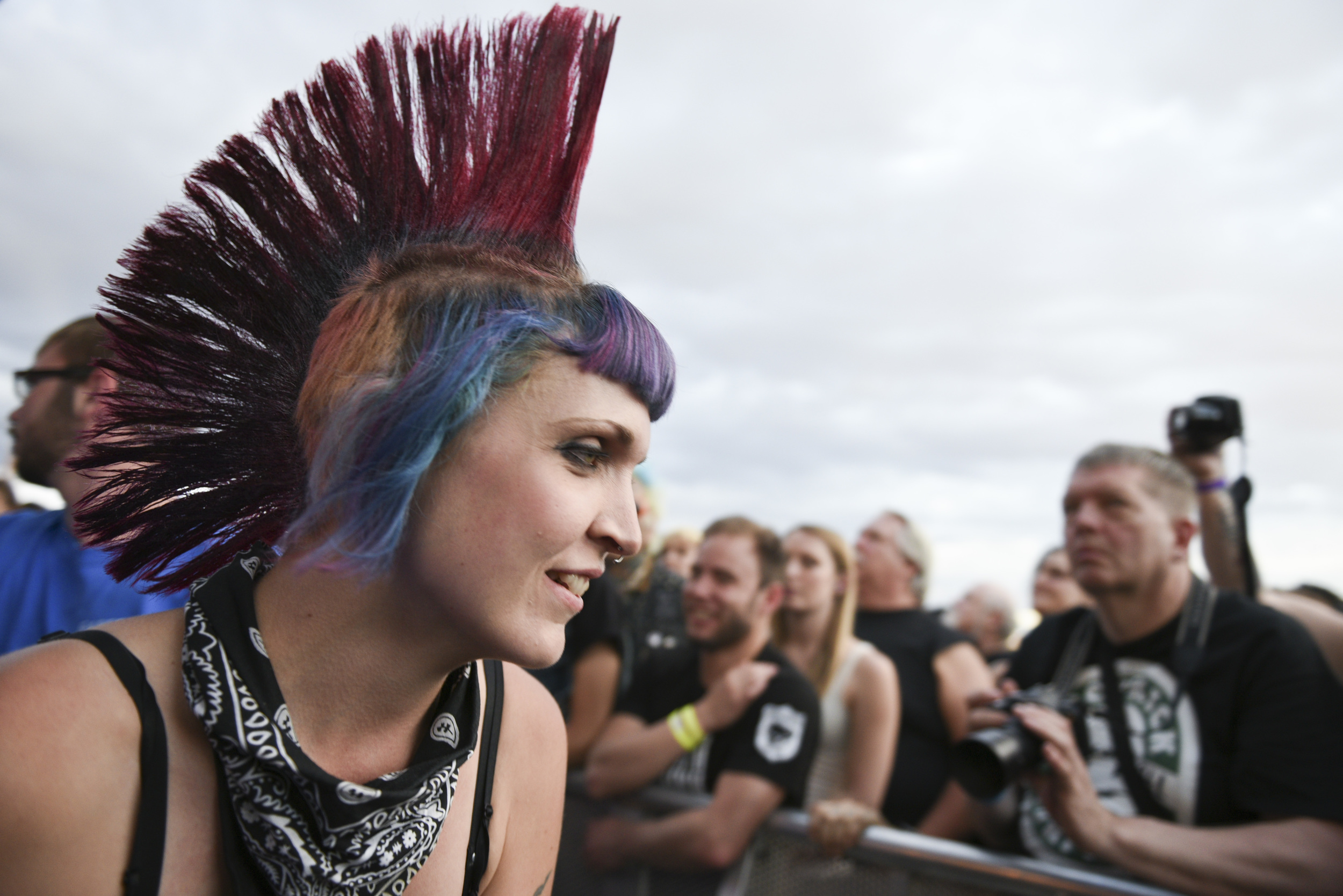 A woman exits the security pit after crowdsurfing during Jello Biafra & The Guantanamo School Of Medicine's set at Punk Rock Bowling music festival in downtown Las Vegas Sunday, May 24, 2015.