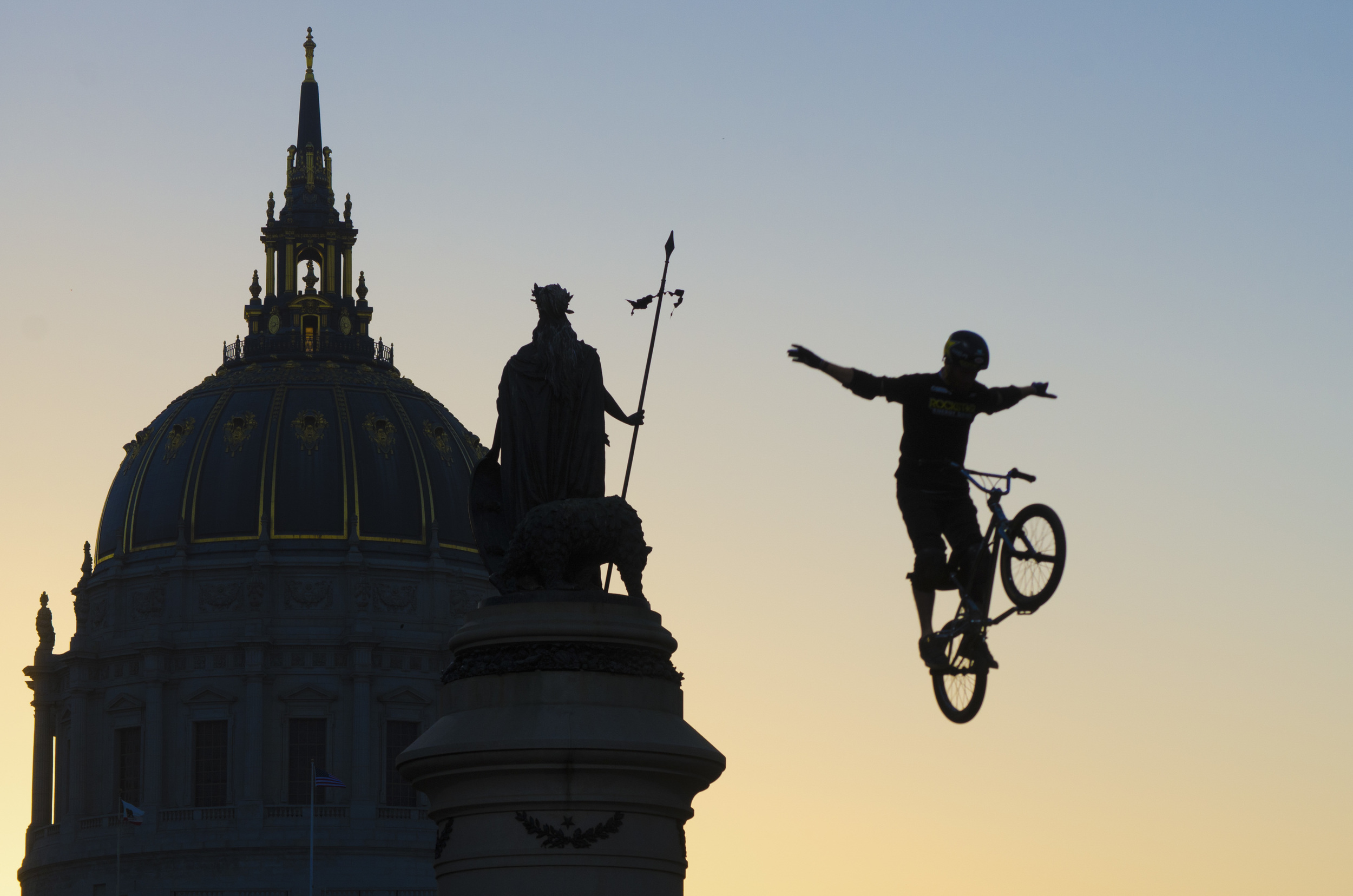 A bmx biker jumps a ramp while giving a demonstration outside of San Francisco's city hall during the Dew Tour on Saturday, Oct. 12, 2013. 