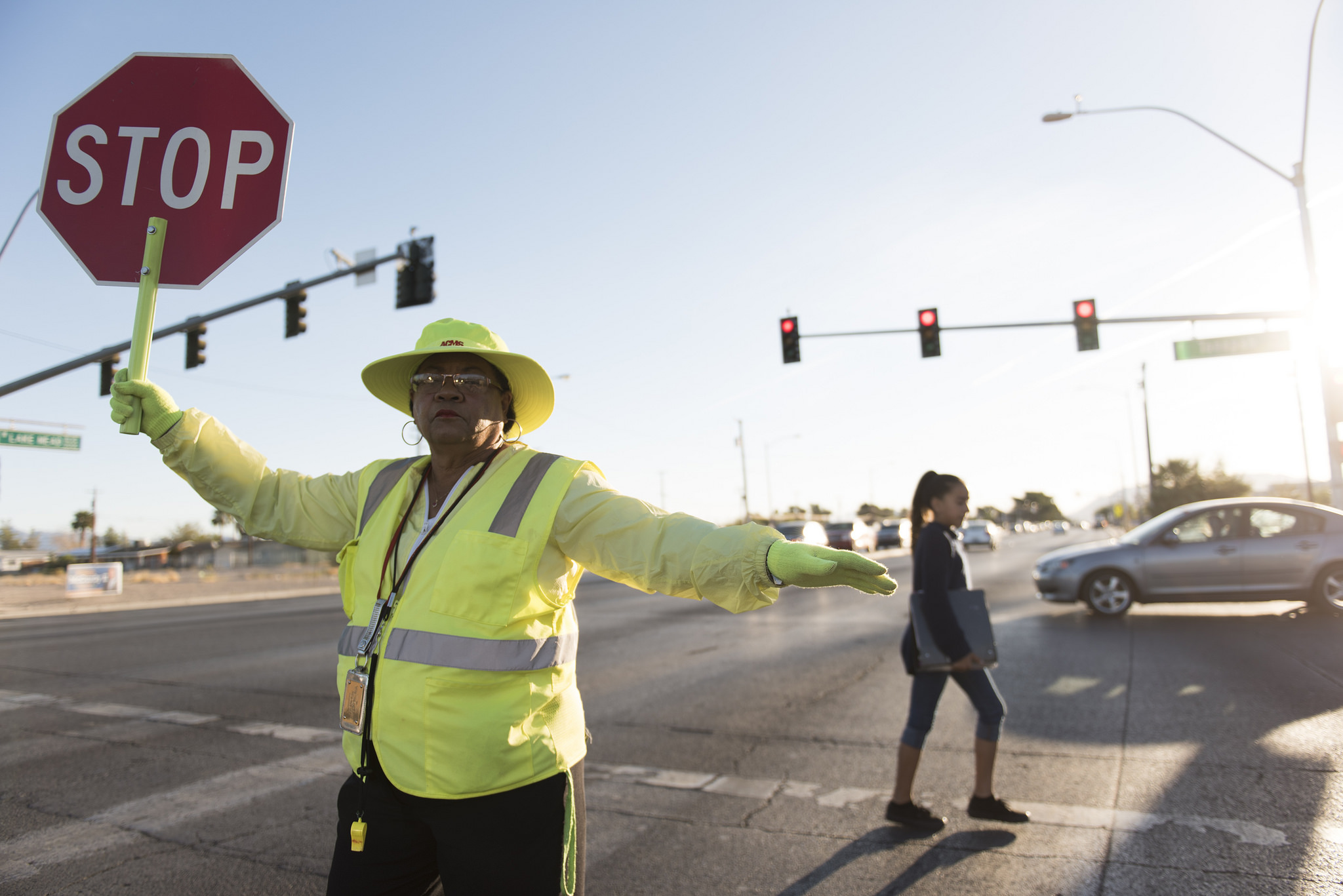 Crossing guard Patricia Bass assists a child in crossing Lake Mead Boulevard at Tonopah Drive before classes at West Preparatory Academy in Las Vegas, Thursday, Oct. 6, 2016. Jason Ogulnik/Las Vegas Review-Journal
