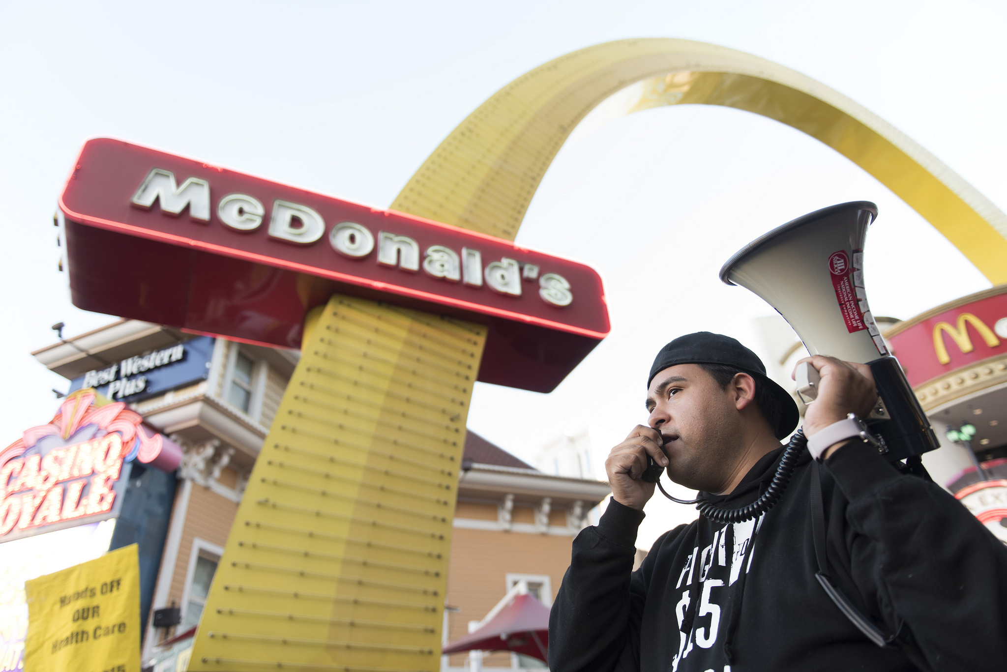 Jose Macias speaks to demonstrators gathered at a Fight for $15 protest outside of the McDonald's restaurant at Harrah's hotel-casino in Las Vegas, Tuesday, Nov. 29, 2016. Demonstrators in more than 300 cities nationwide gather at fast-food restaurants to demand minimum wage be raised to $15/hour.