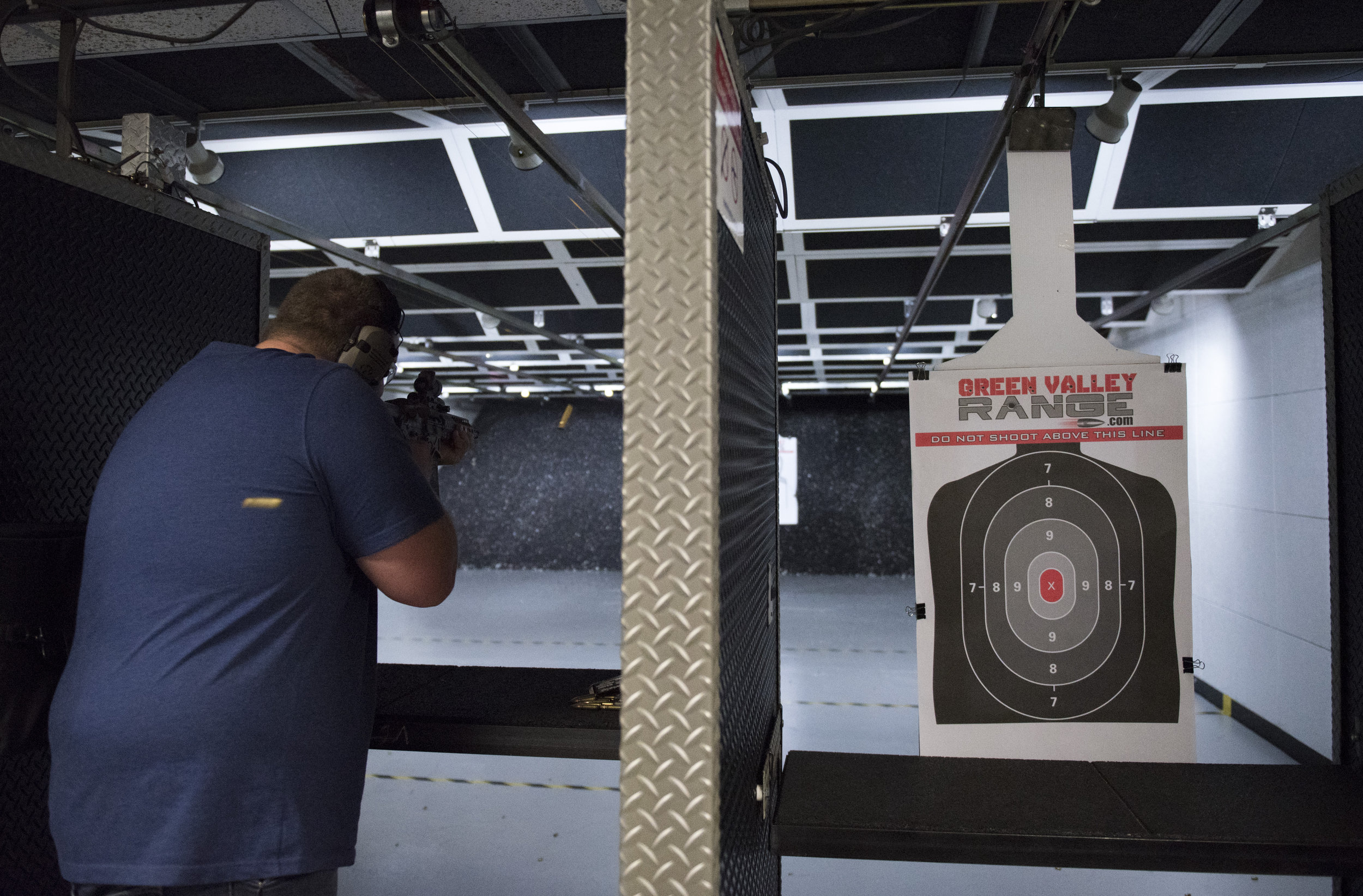 Battle Arms Development employee Tyler Schlappi does a function test on a short-barreled rifle at Green Valley Range in Henderson, Nev., Nov. 14, 2016. 
