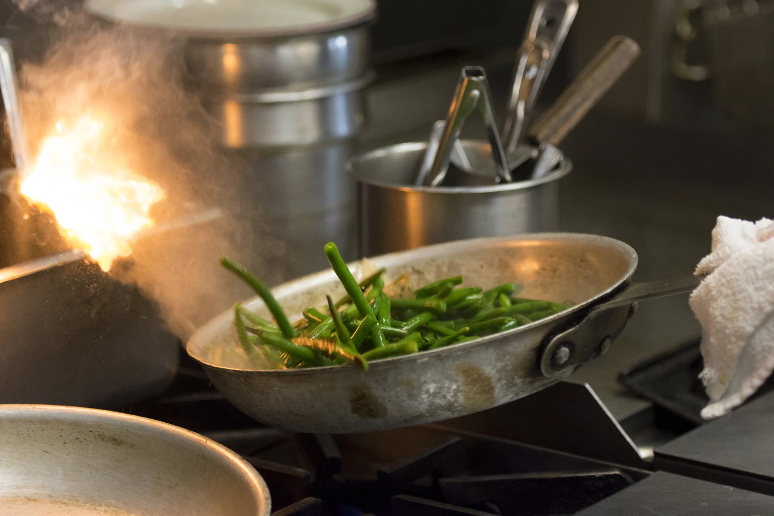 A student sautees green beans during the Professional Cook class at the Culinary Academy of Las Vegas.