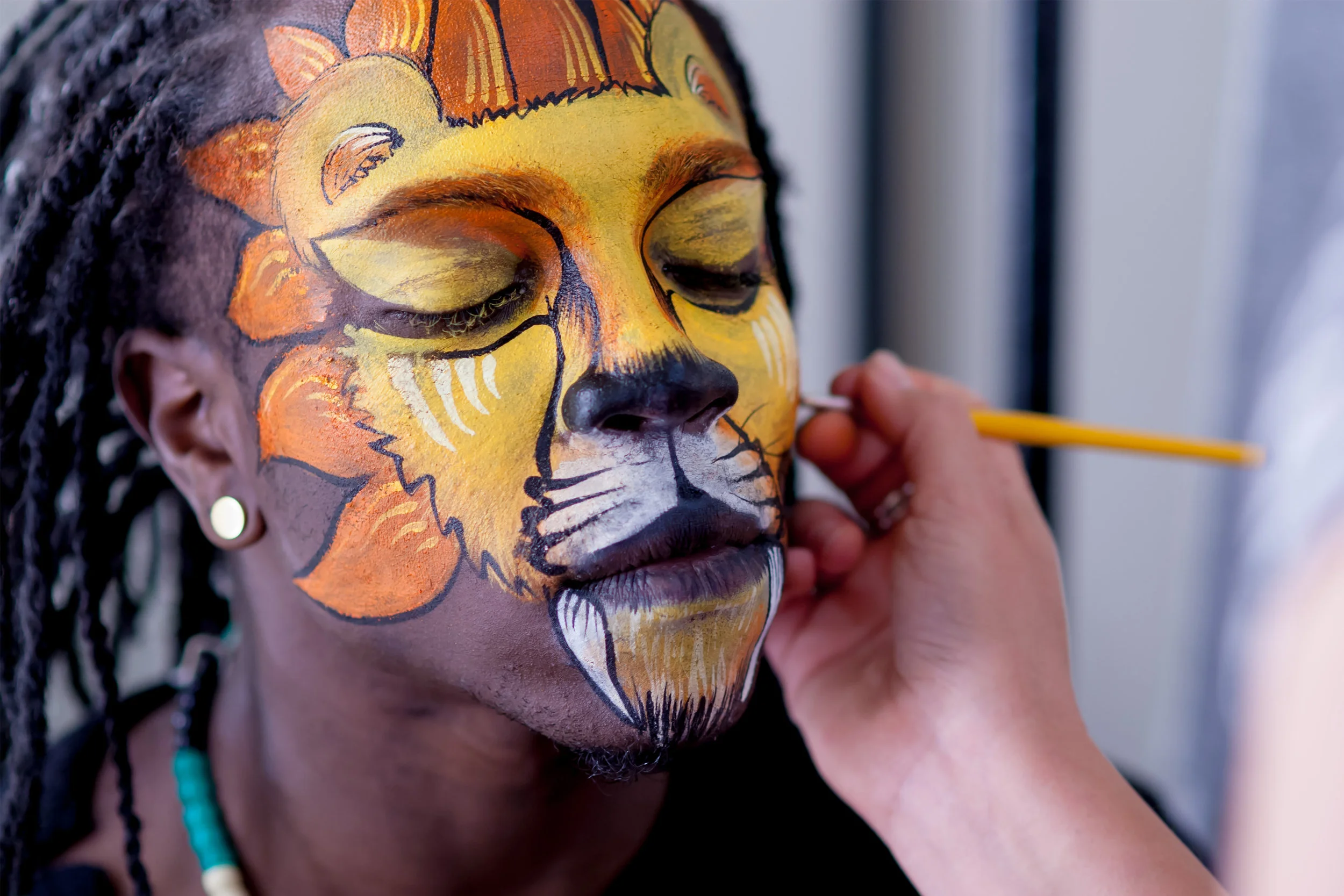 Dancer Eric R. J. Freeman as the Lion in "Cat's Protector"