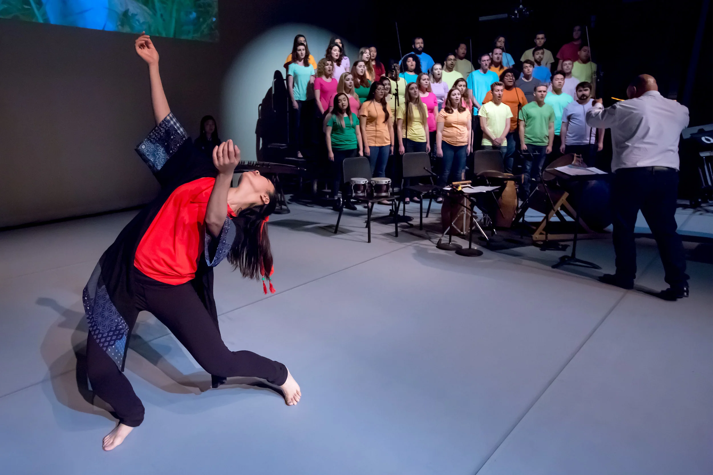 Jonathan Talberg conducts the Bob Cole Chamber Choir of CSU Long Beach, in rehearsal of “Lord of the Cranes” with choreographer/dancer Jingqiu Guan