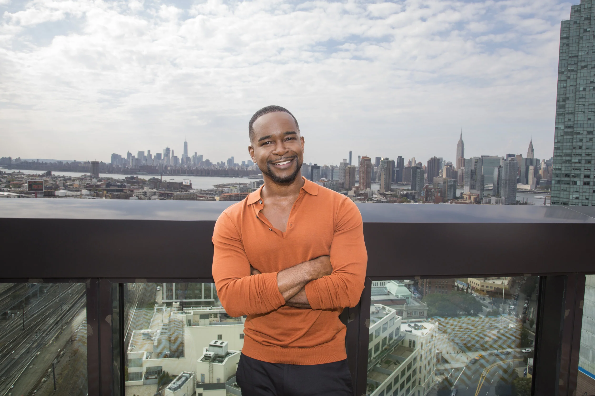 Jeremyhassell@gmail.com arms closed orange shirt skyline4D7A4345.jpg