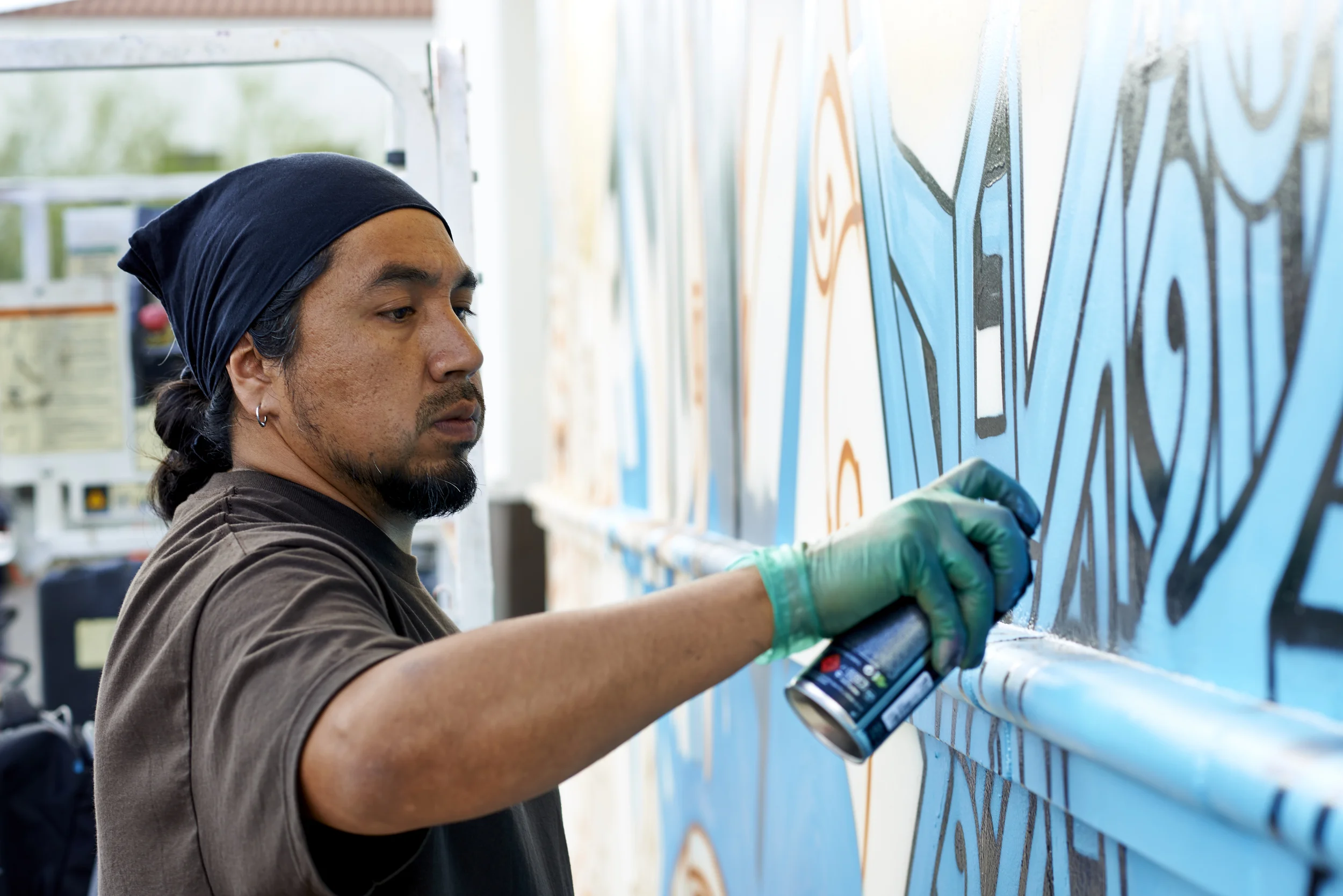 Thomas Breeze Marcus, local Arizona muralist at work. 