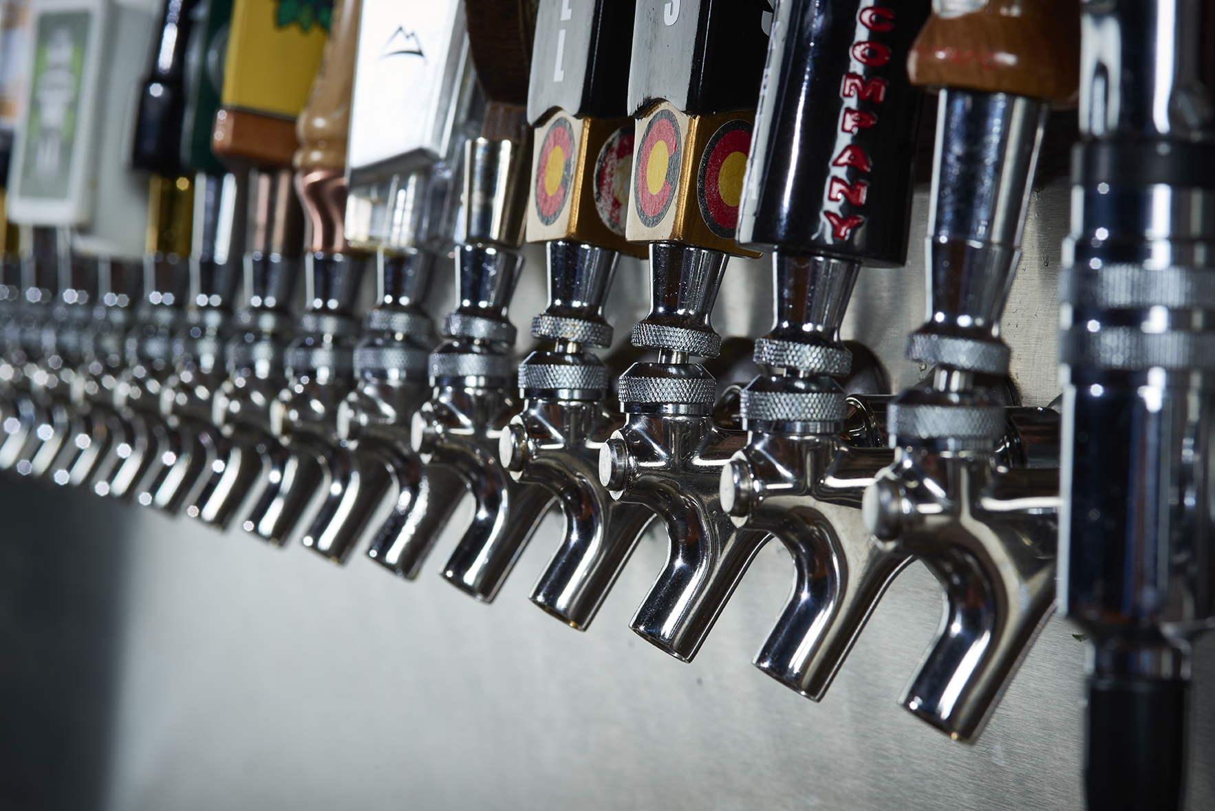 Row of beer taps. 