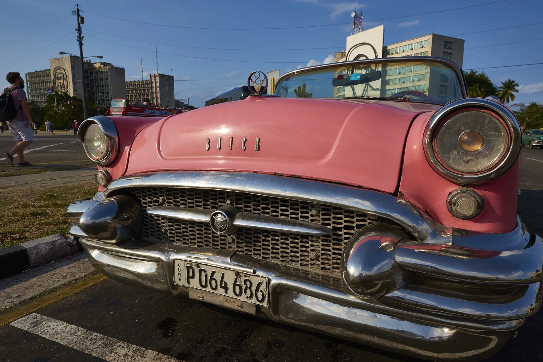 Pink vintage car in historical square in Havana, Cuba. 