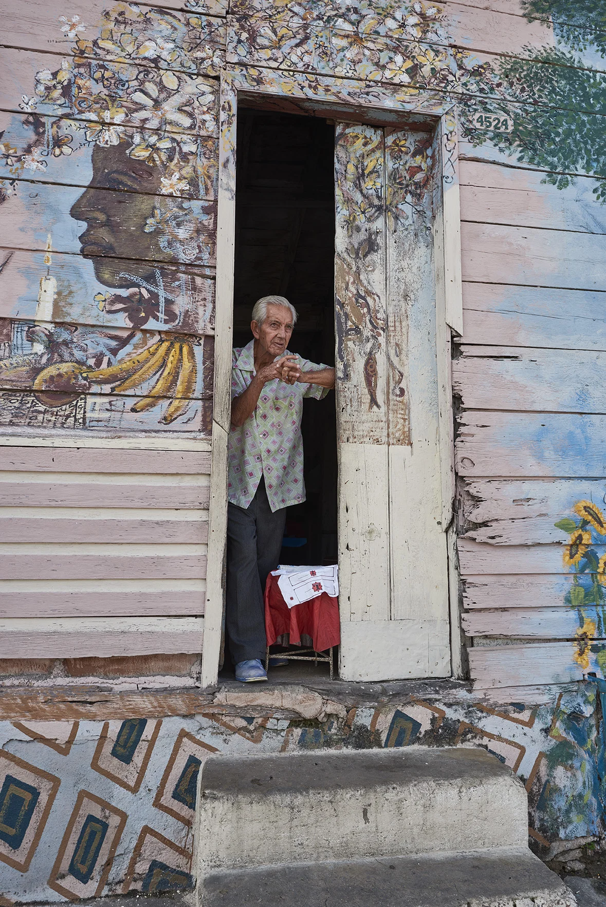 Man looking out door in Santiago de Cuba, Cuba. 